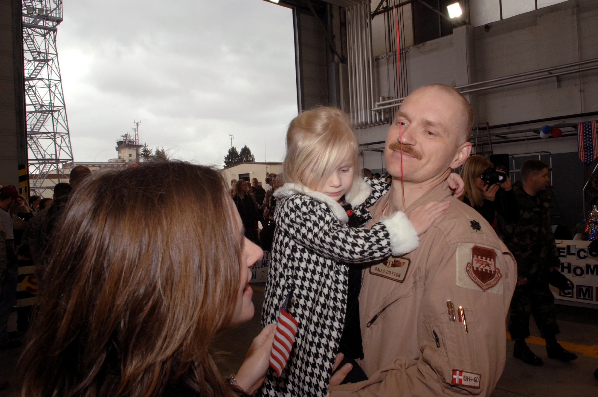 SPANGDAHLEM AIR BASE, Germany – Lt. Col. John Cotton, 22nd Fighter Squadron, holds his daughter, Olivia, after returning from a deployment in support of Operation Iraqi Freedom Feb. 6, 2008. (U.S. Air Force photo/Senior Airman Logan Tuttle)