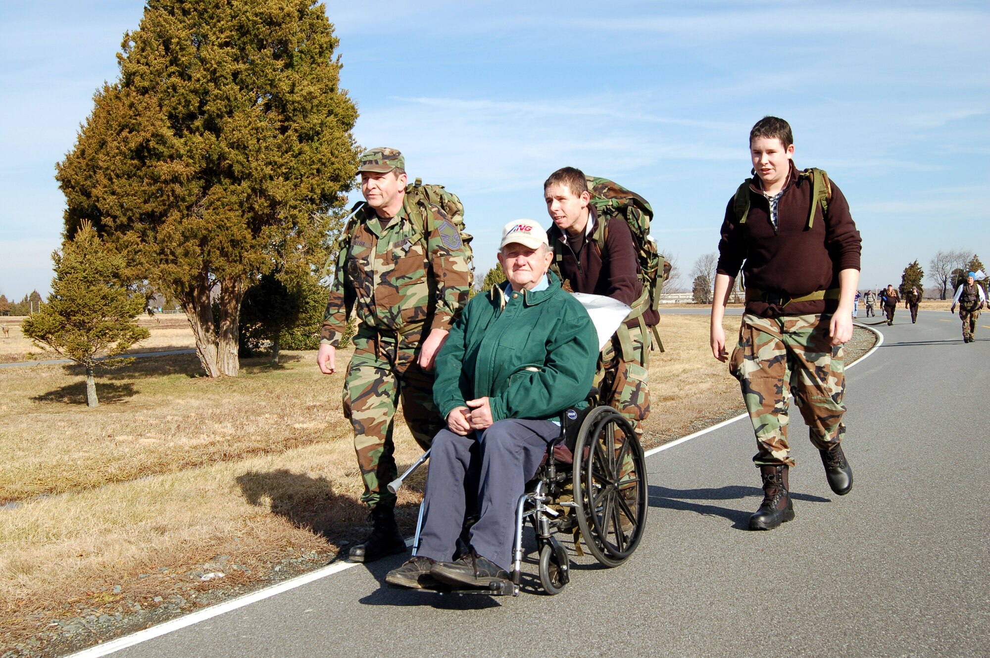 Senior Master Sgt. James Yetter, retired Army Cpl. Charles Yetter, Luke and Alex Yetter, commemorated the Korean War at the 9th Annual Ruck March held at the Air Mobility Command Museum Feb. 2. (U.S. Air Force Photo/ Airman 1st Class Shen-Chia Chu)
