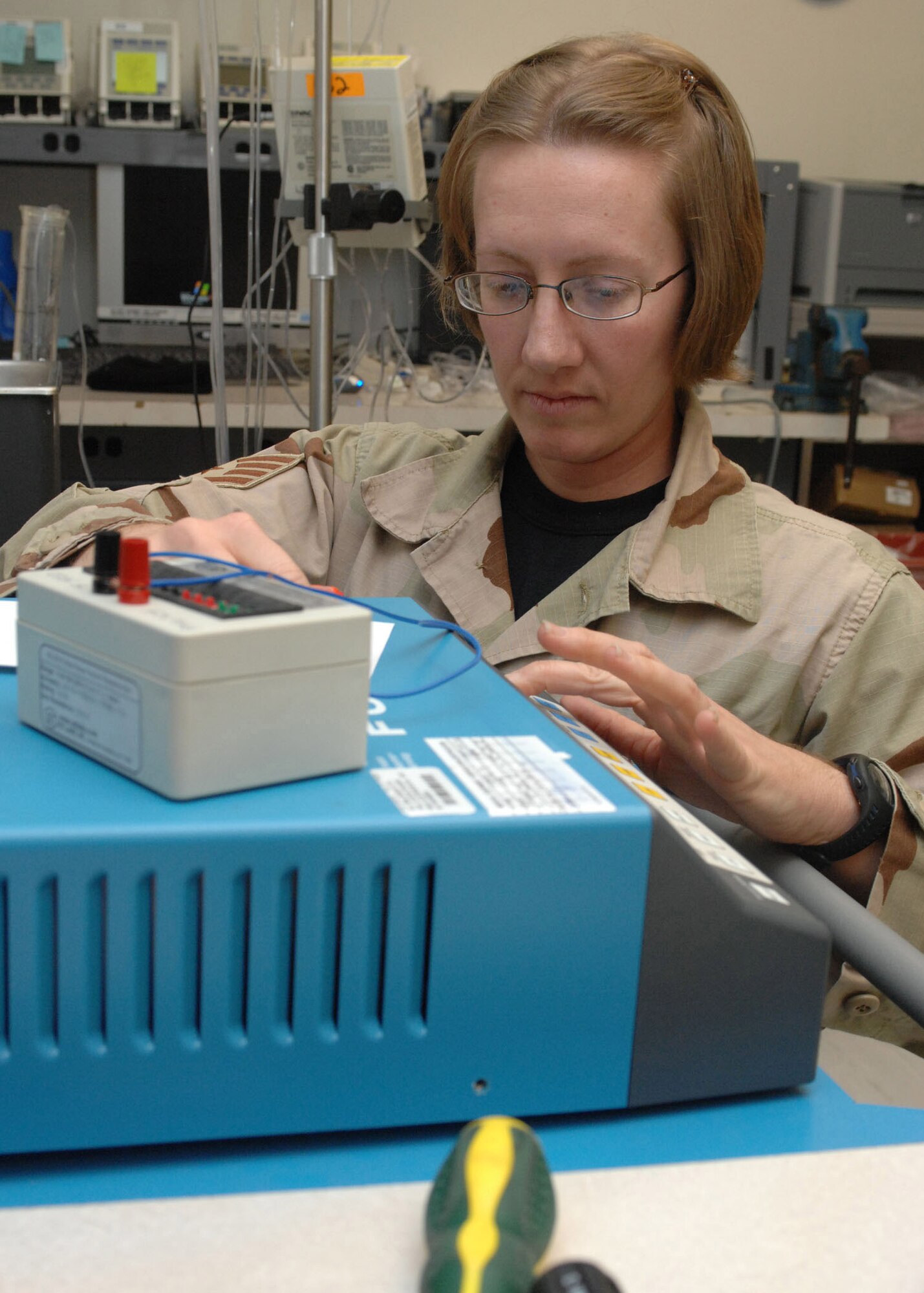 Staff Sgt. Jana Madrid works on a electrosurgical unit Feb. 5 at Bagram Air Base, in Afghanistan. Sergeant Madrid is responsible for maintaining all medical equipment at the Craig Joint Theater Hospital here. Sergeant Madrid is a biomedical equipment technician deployed from the 49th Medical Support Squadron at Holloman Air Force Base, N.M. The Craig Joint Theater Hospital is a state-of-the-art hospital that rivals any stateside hospital of equivalent size. (U.S. Air Force photo/Master Sgt. Demetrius Lester)
