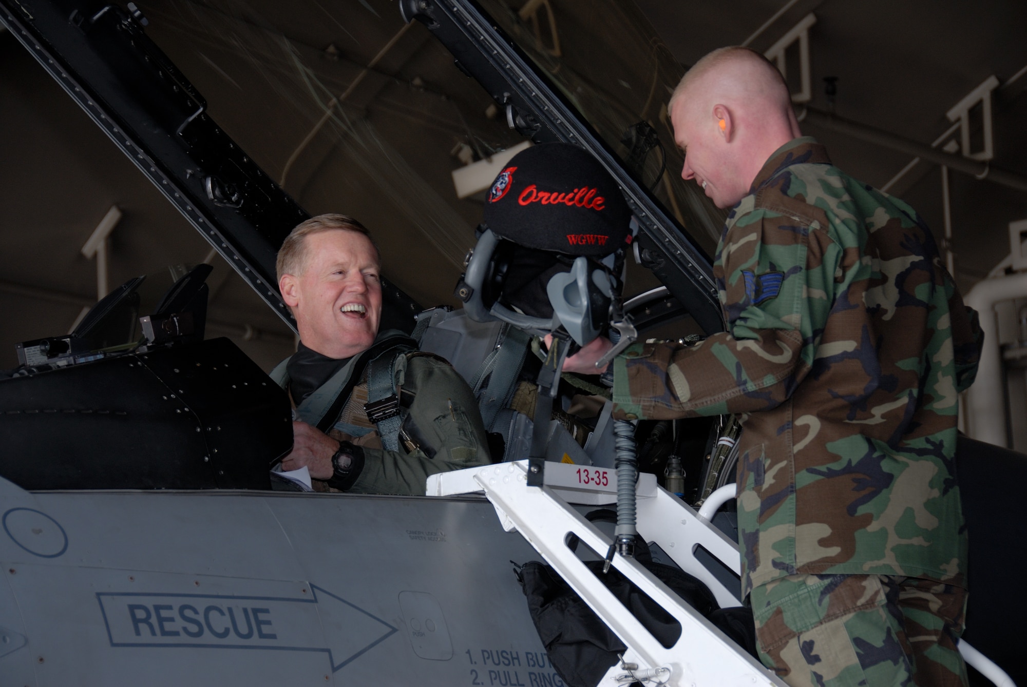 MISAWA AIR BASE, Japan -- Staff Sgt. Jeremy Page, 13th Fighter Squadron dedicated crew chief, helps prepare Lt. Gen. Bruce Wright, 5th AF commander, for his final flight in the 5th AF flagship fighter jet here, Feb. 6, 2008.  General Wright's flight in the jet marked the last time this jet will be flown as the 5th AF flagship.  (U.S. Air Force photo by Senior Airman Laura R. McFarlane)