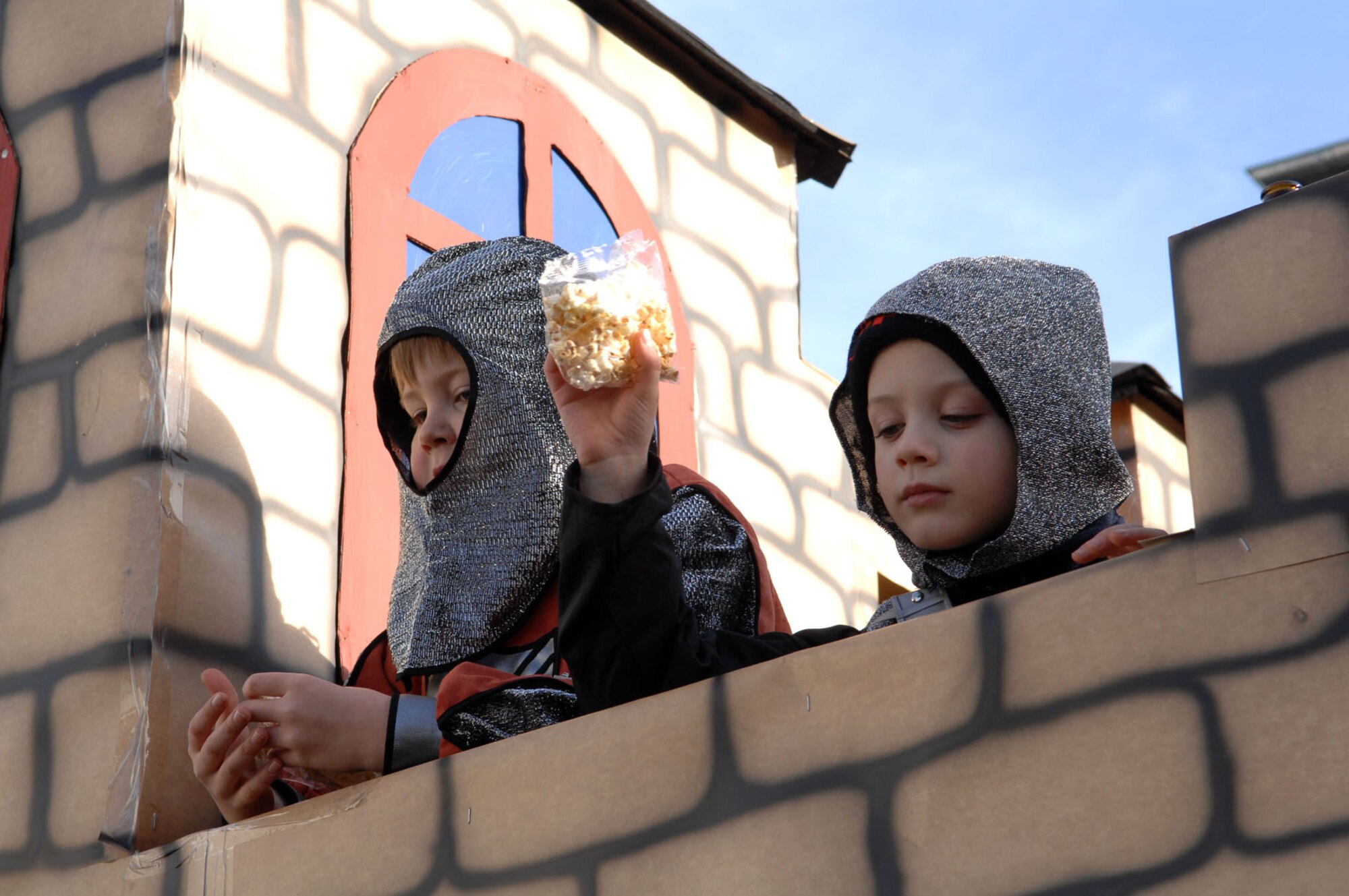 SPANGDAHLEM AIR BASE, Germany -- Children participating in the Wittlich Fasching Parade, held annually the Sunday prior to Ash Wednesday as part of the carnival festivities in Germany, toss bags of popcorn and candy to hordes of children lining the parade route, Feb. 3, 2008. (U.S. Air Force photo/Senior Airman Matthew S. Bright) 