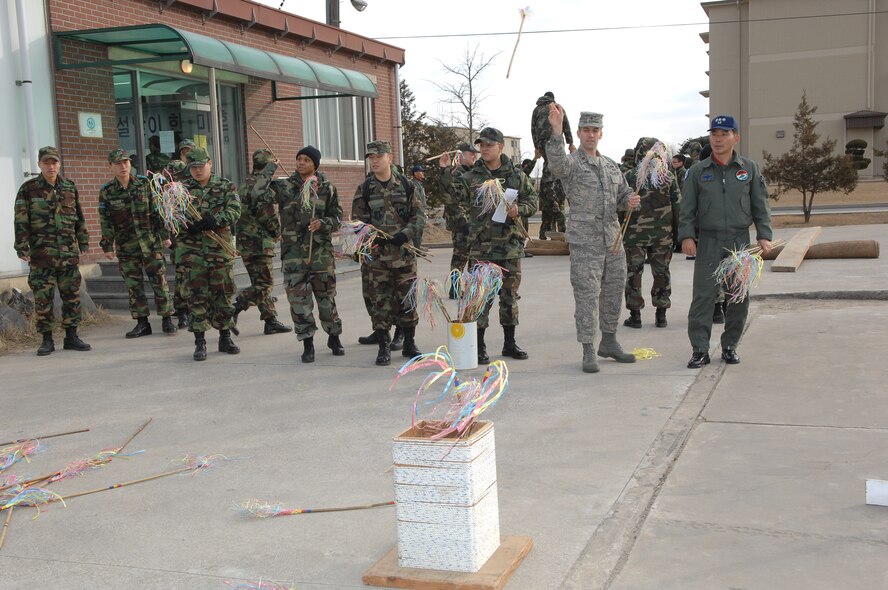 KUNSAN AIR BASE, South Korea --  Members of the ROKAF 38th Fighter Group and the 8th Fighter Wing participate in traditional Korean games in celebration of the Korean Lunar New Year here Feb. 7. The Lunar New Year event is one of many events hosted by ROKAF members in order to strengthen ties and gain cultural awareness with U.S. military members.  (ROKAF photo/Master Sgt. Choi Yong Sik) 
