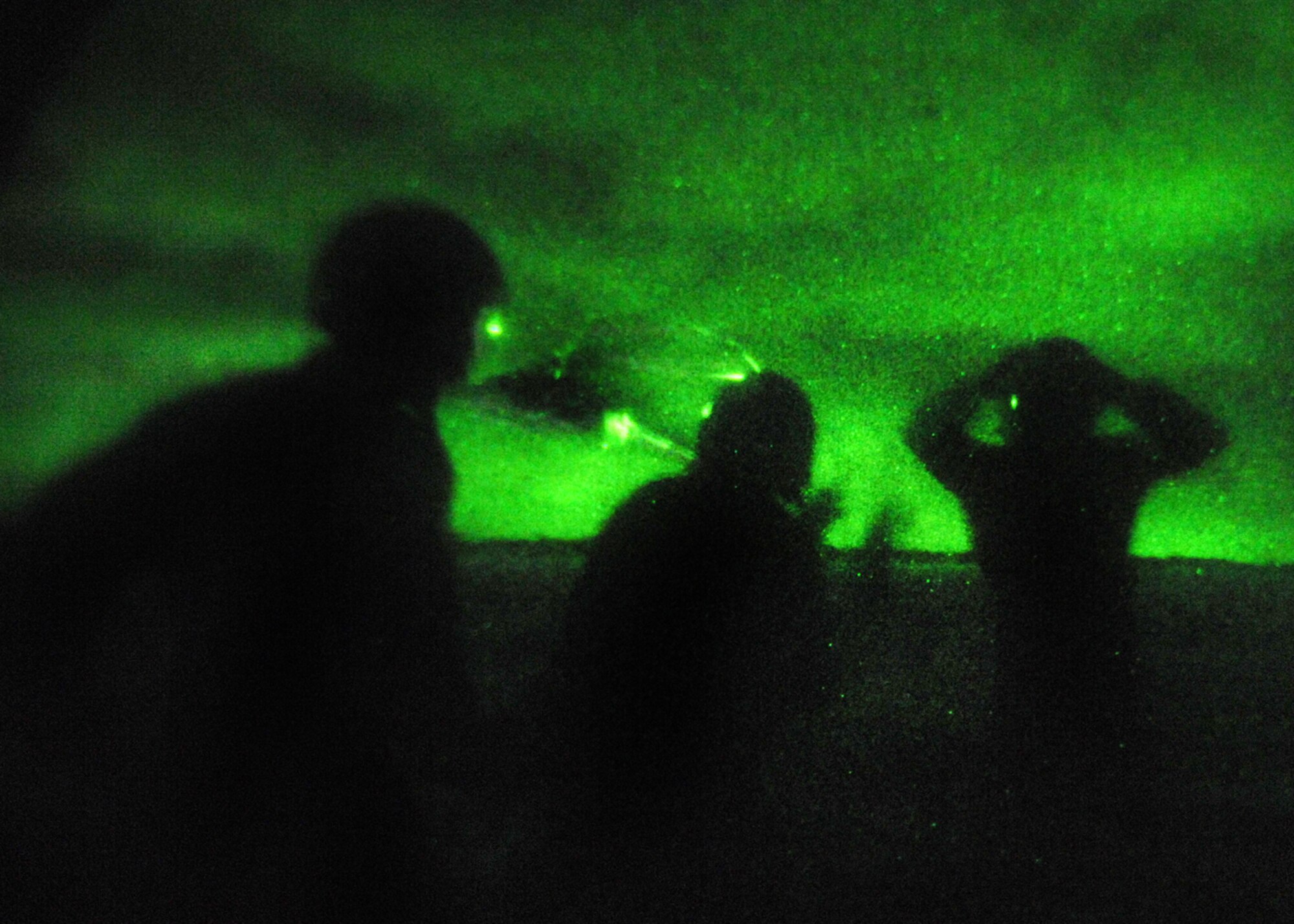 Andersen AFB, Guam -- B-2 Spirit pilots from the 393rd Expeditionary Bomb Squadron raise their arms up in a non-defensive position as they are rescued by helicopter. The 393 EBS pilots learned basic combat survival tactics during a two day SERE refresher course. The B-2 Spirit bomber pilots are deployed from Whiteman AFB, MO.
(U.S. Air Force Photo By Staff Sgt. Vanessa Valentine) 