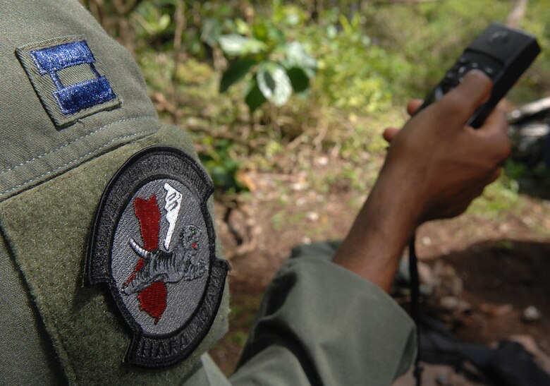 Andersen AFB, Guam -- U.S.Air Force Captain Joseph Tullos programs coordinates into his global positioning system. B-2 Spirit pilots from the 393rd Expeditionary Bomb Squadron used the GPS system to find their way though the thick jungle where they would later be picked up by helicopter during a two day refresher course on survival evasion resistance and escape techniques specific to the tropical climate. The B-2 Spirit bomber pilots are deployed from Whiteman AFB, MO.
(U.S. Air Force Photo By Staff Sgt. Vanessa Valentine) 