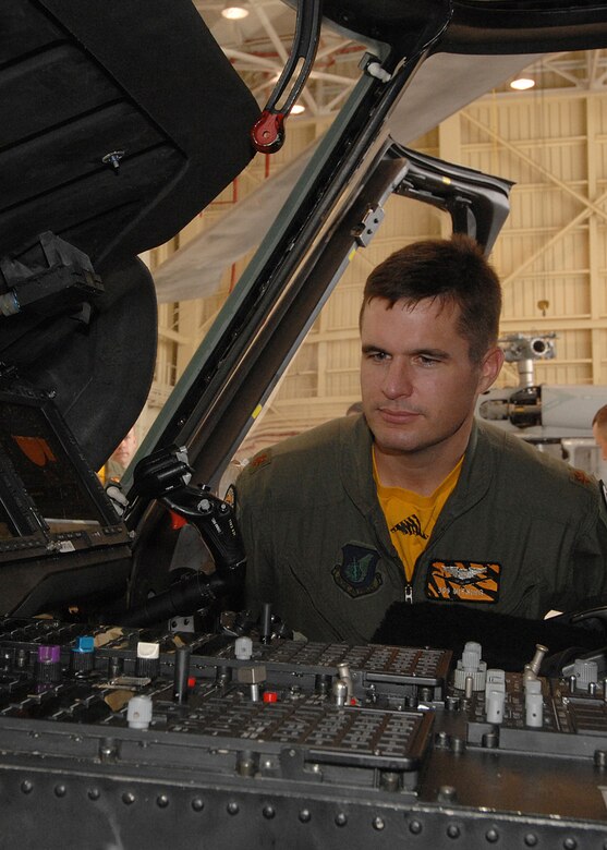 Andersen AFB, Guam -- U.S.Air Force Major Ryan Link checks out the flight deck on a Navy MH-60S helicopter. B-2 Spirit pilots from the 393rd Expeditionary Bomb Squadron learned about helicopter medical evacuation procedures during a two day refresher course on survival evasion resistance and escape techniques specific to the tropical climate. The B-2 Spirit bomber pilots are deployed from Whiteman AFB, MO.
(U.S. Air Force Photo By Staff Sgt. Vanessa Valentine) 
