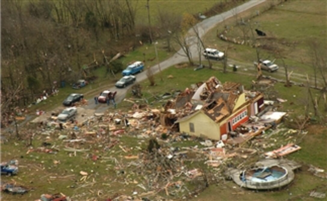 A Tennessee National Guard member captures an aerial view of tornado damage in Tennessee while travelling with the governor's staff, Feb. 6, 2008, to assess the situation. 