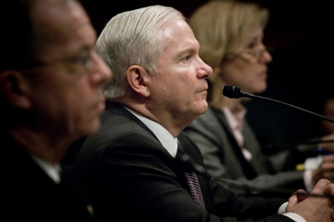 Secretary of Defense Robert M. Gates (center) is flanked by Chairman of the Joint Chiefs of Staff Adm. Mike Mullen (left), U.S. Navy, and Under Secretary of Defense (Comptroller) Tina Jonas as he testifies before the House Armed Services Committee concerning the Fiscal Year 2009 National Defense Budget at the Dirksen Senate Office Building in Washington, D.C., on Feb. 6, 2008.  