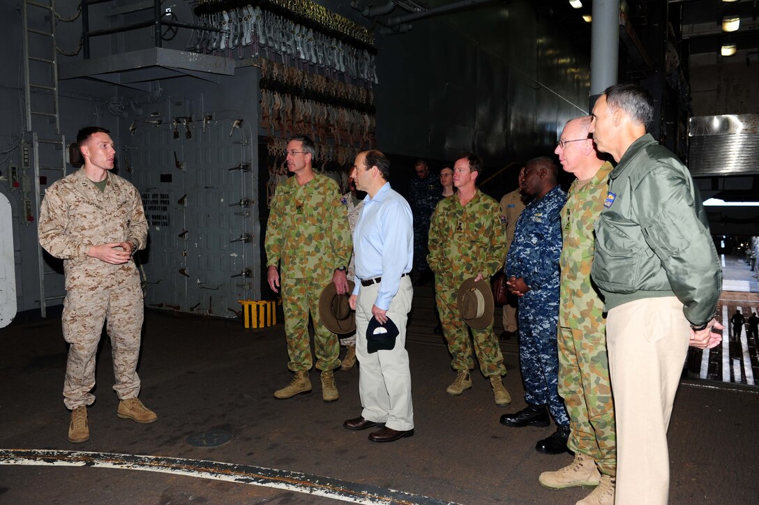 U.S. Marine Corps Capt. Ben Van Zytveld, 31st Marine Expeditionary Unit, explains the MEUs capabilities to Commander, Seventh Fleet Vice Adm. Scott Van Buskirk and Australian Army dignitaries during a visit to the USS Germantown (LSD 42). TS11 is the largest joint military exercise undertaken by the Australian Defence Force. Around 14,000 U.S. and 9,000 Australian personnel will participate. TS11 provides an opportunity to conduct operations in a combined and joint environment that will increase both countries’ bilateral war-fighting capabilities to respond to crisis and to provide humanitarian assistance. The 31st MEU is the only continuously forward-deployed MEU and remains the nation’s force in readiness in the Asia-Pacific region.