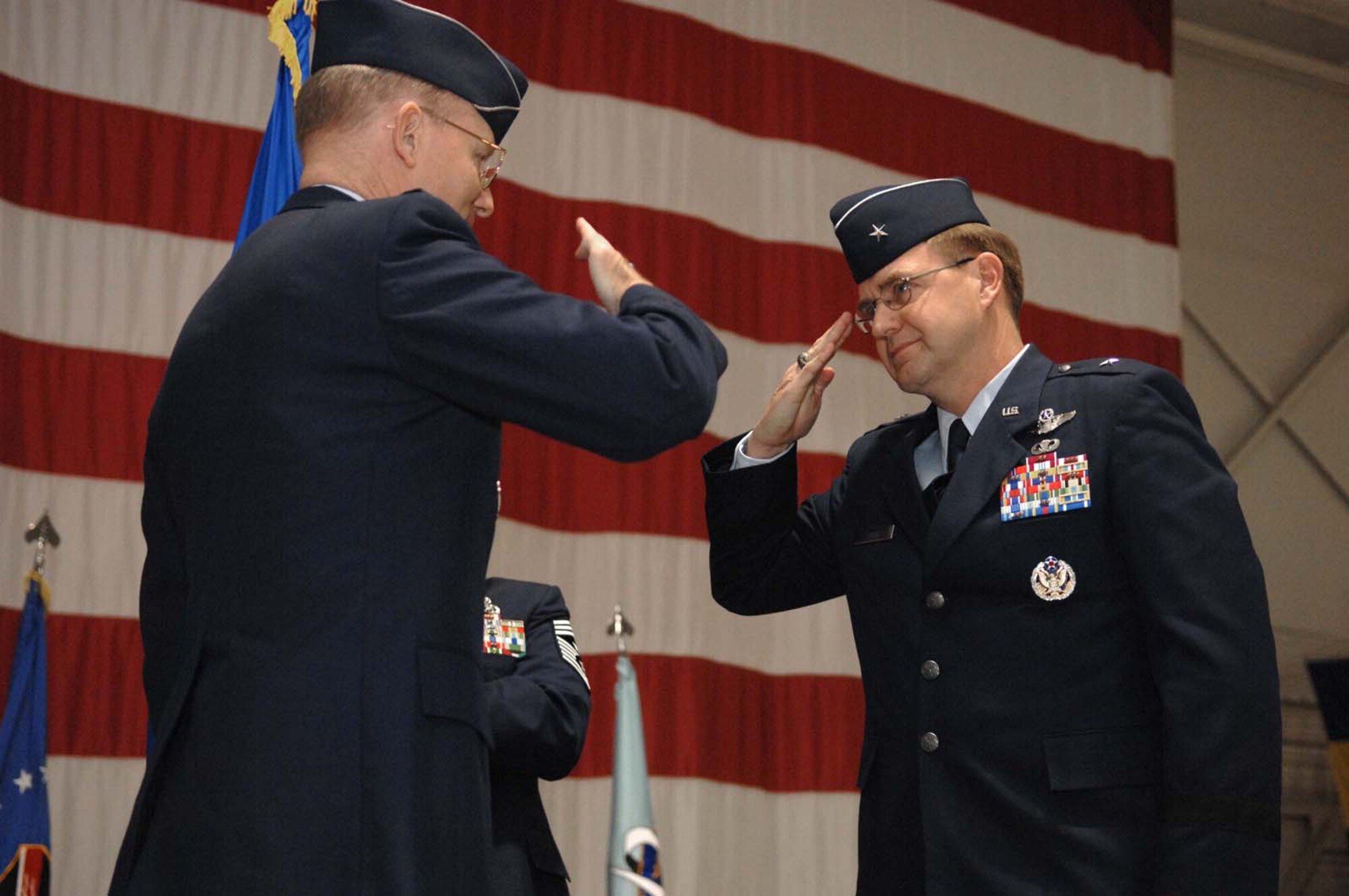 General John D.W. Corley (left), commander, Air Combat Command, returns a salute to newly appointed United States Air Force Warfare Center commander, Brig. Gen. Stephen L. Hoog, during the official USAFWC Change of Command ceremony Feb. 8, Nellis Air Force Base, Nev. (U.S. Air Force Photo by Senior Airman Larry E. Reid Jr.)