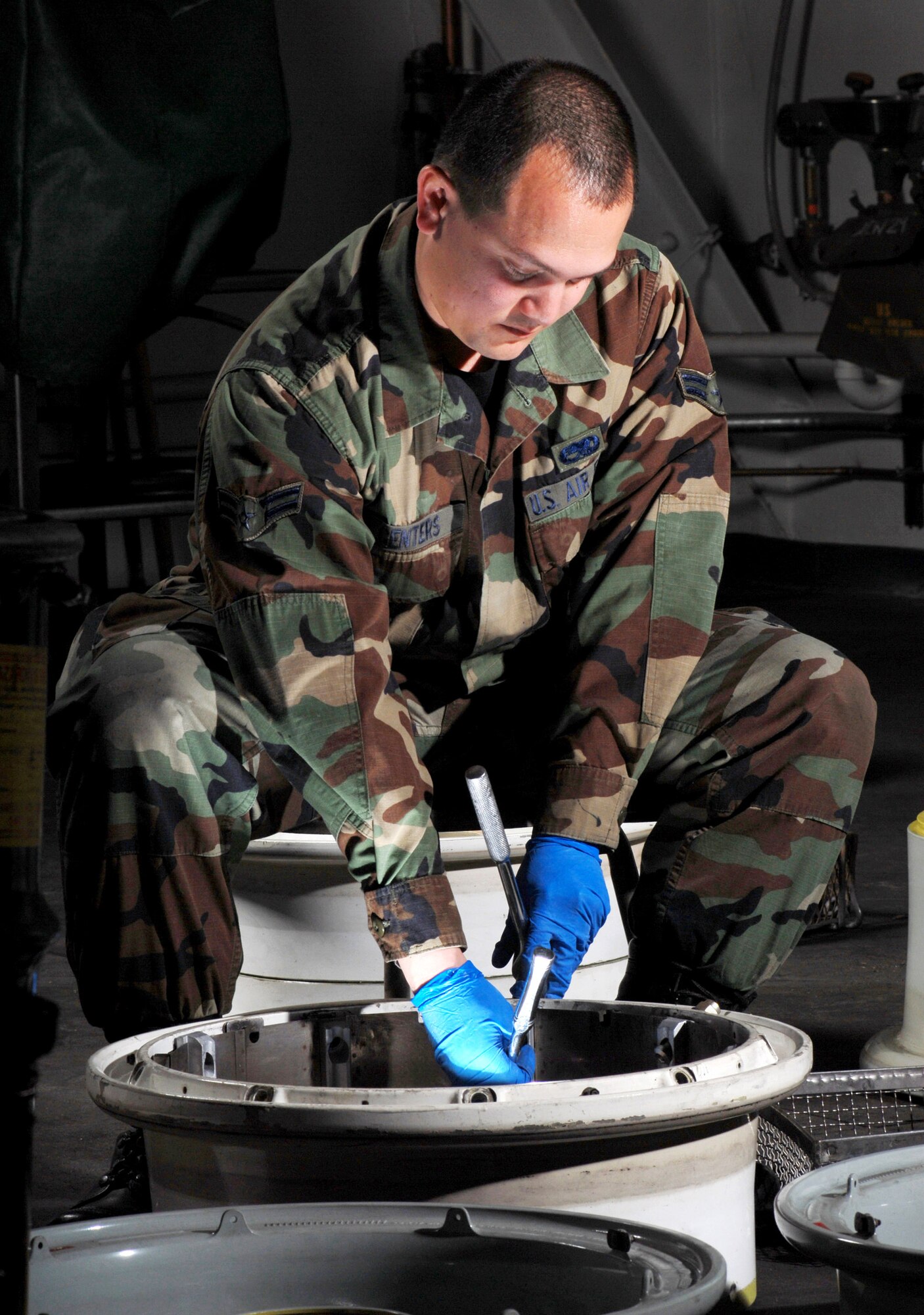 Airman 1st Class Jonathan Centers, an aircraft mechanic from the Aero Repair Shop at March Air Force Base, Calif., uses a ratchet wrench Feb. 3 to install a heat shield on a KC-135 Stratotanker refueling aircraft main wheel.  March ARB, located in Southern California, is home to the largest air mobility wing in the Air Force Reserve Command. It also is home to units from the Army Reserve, Navy Reserve, Marine Corps Reserve and Air National Guard. (U.S. Air Force photo/Val Gempis)