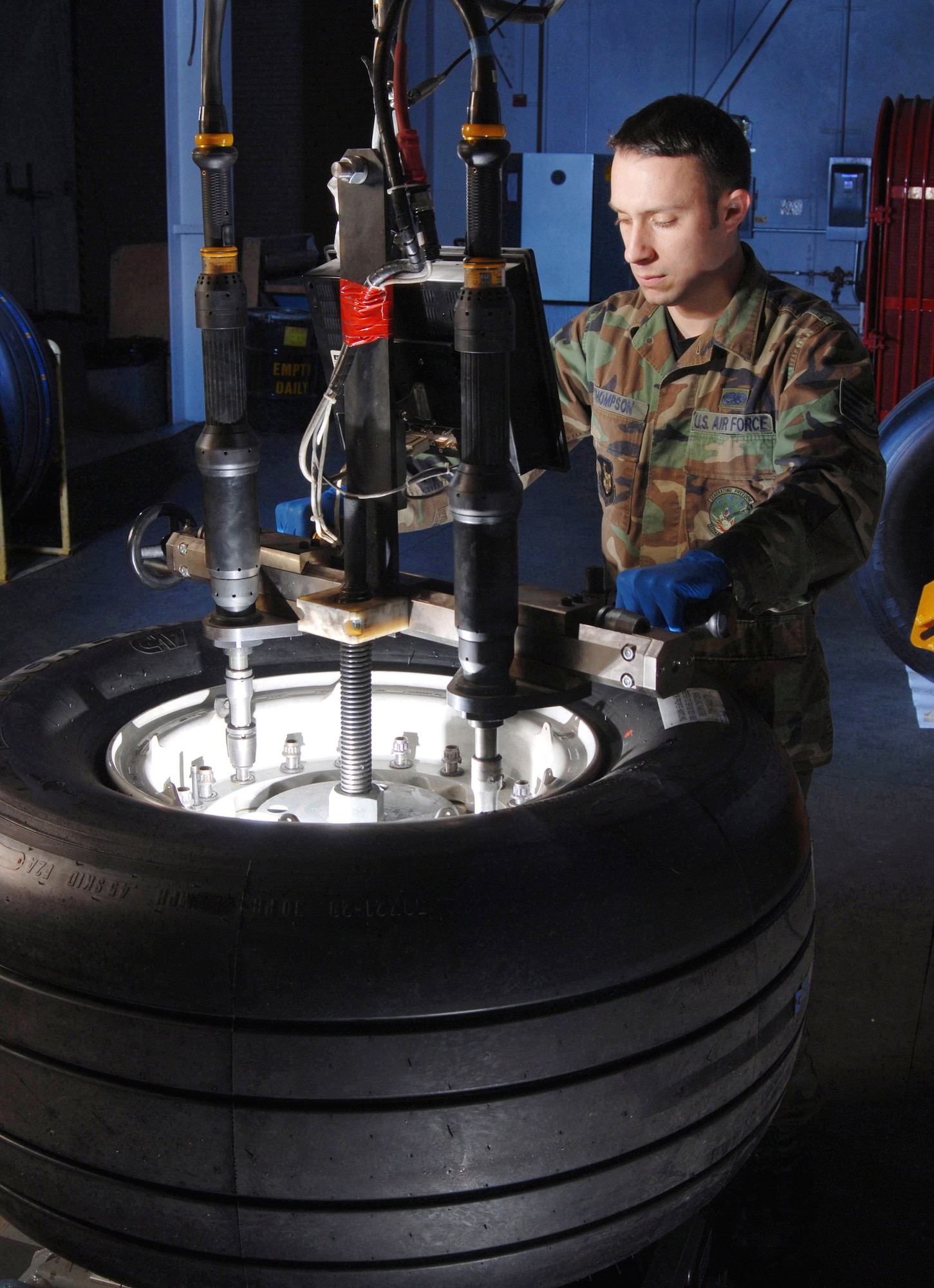 Staff Sgt. Greg Thompson, an aircraft mechanic from the Aero Repair Shop at March Air Reserve Base, Calif., uses a wheel and tire assembly fixture and torquing machine Feb. 3 to mount a tire on a C-17 Globemaster III cargo aircraft wheel.  March ARB, located in Southern California, is home to the largest air mobility wing in the Air Force Reserve Command. It also is home to units from the Army Reserve, Navy Reserve, Marine Corps Reserve and Air National Guard. (U.S. Air Force photo/Val Gempis)