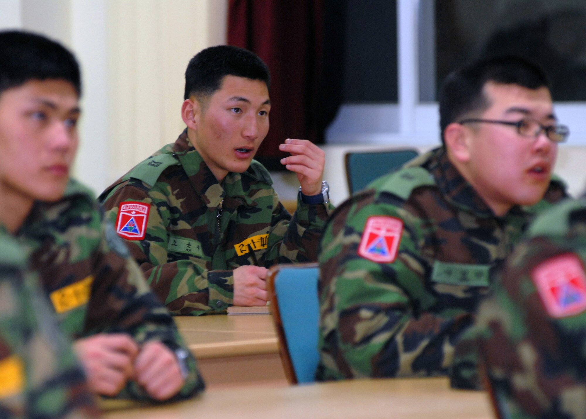 South Korean army NCO Academy students repeat phrases after their instructor Jan. 31  at Kunsan Air Base, South Korea. Numerous Airmen from the 5/6 group volunteer to teach assist South Korean army cadets English. (U.S. Air Force photo/Staff Sgt. Araceli Alarcon) 
