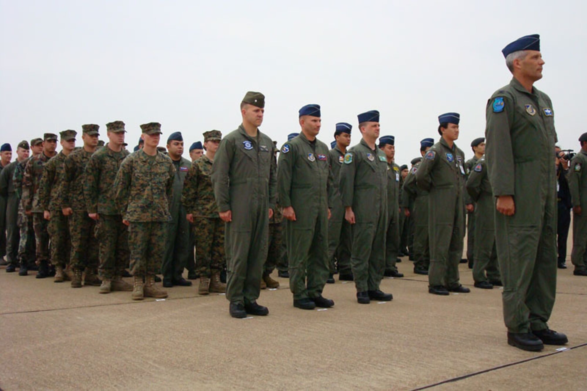 KORAT ROYAL THAI AIR BASE, Thailand – Col. James Horton, 13th Air Expeditionary Wing commander for Exercise Cope Tiger 2008, stands at attention in front of the U.S. formation of Airmen and Marines at the exercise’s official closing ceremony here Feb. 5. The Royal Thai Air Force and the Republic of Singapore Air Force participated in the 13th annual multilateral exercise with the U.S. Air Force and the U.S. Marine Corps from Jan. 26 to Feb. 5. (U.S. Air Force photo/Capt. Renee Lee)