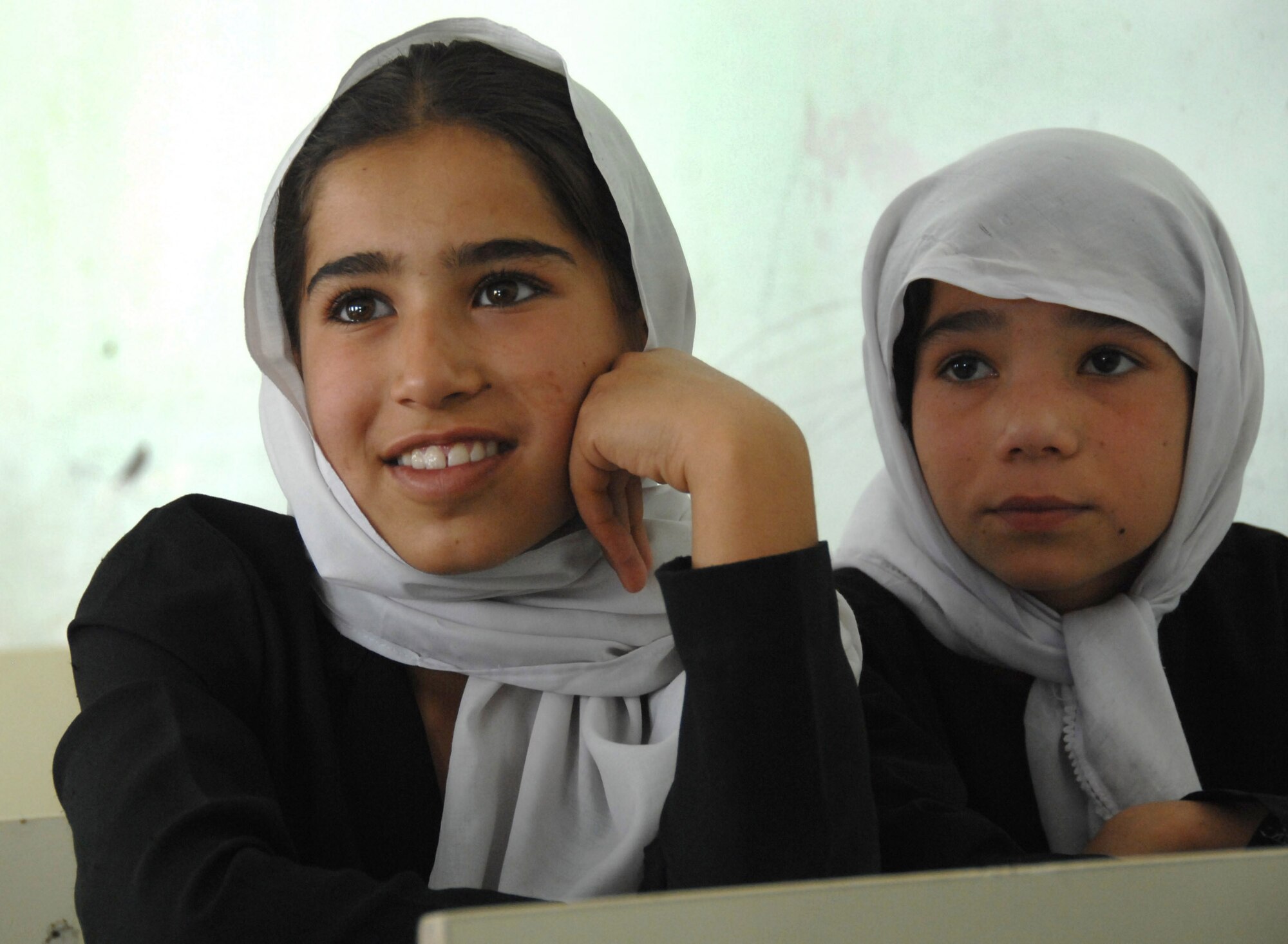 Female Afghan students sit in their Kabul classroom. International Security Assistance Force troops visited the school Aug. 5, 2007, to deliver school supplies. (ISAF photo by Master Sgt. Russell P. Petcoff)