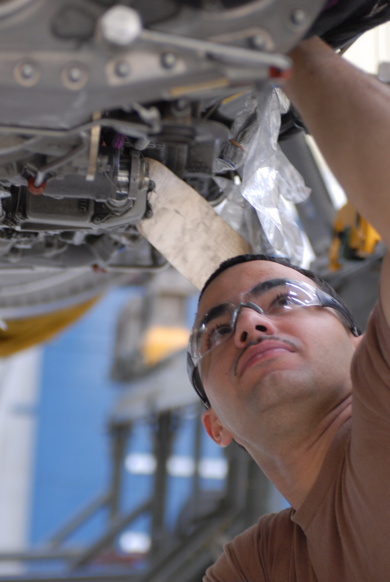 Senior Airman Kurtis Hagen, 56th Component Maintenance Squadron aerospace propulsion journeyman, installs a group six deec. This component controls the engine and all electronic signals. (photo by Staff Sgt. Christopher hummel)