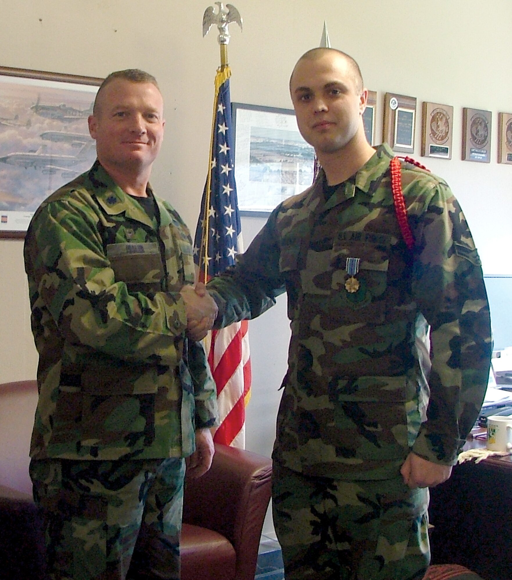 Lieutenant Colonel Paul Issler, 311th Training Squadron commander, congratulates Airman 1st Class Michael Burbridge’ after Airman Burbridge was awarded the Joint Service Achievement Medal Jan. 25 at the Presidio of Monterey, Calif.

Airman Burbridge, a Pashto-language linguist student with the 311 TRS, was awarded the JSAM for his duties as assistant to the NCO in charge for the Presidio of Monterey Joint Service Funeral Detail. His joint service detail was responsible for paying proper respects to veterans at 50 funerals while projecting the highest military professional image to the surrounding community of Monterey, Calif.
 
Airman Burbridge is also the Airman leader / red rope flight commander for the 430-person 311 TRS Raptor Flight. He is from Mount Vernon, Iowa, and will graduate in March. His effectiveness as a leader enabled him to recruit, train, and maintain accountability of 60 Airmen, Sailors, Soldiers and Marines. Airman Burbridge hopes to be assigned to either a EC-130E Senior Scout reconnaissance aircraft or as an Air Force Special Operations Command direct support operator.
 
(U.S. Air Force photo by Senior Master Sgt. Leo Chang)
