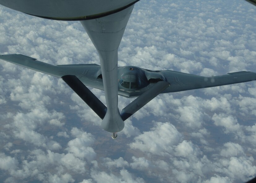 GRAND FORKS AIR FORCE BASE, N.D. - A B-2 Spirit approaches the boom of a 319th Air Refueling Wing KC-135 Stratotanker for aerial refueling over the skies of the Midwest. Able to fly more than 1,500 miles with 150,000 pound transferable of transferable fuel, the KC-135 enable global reach for U.S. and allied aircraft. (U.S. Air Force photo/Senior Airman Chad Kellum)