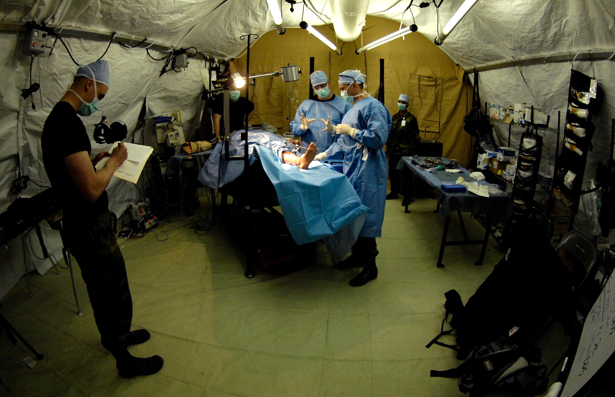 Medics go through an operation scenario during Exercise Pacific Lifeline Feb. 5 at Kona International Airport, Hawaii. The Airmen are from the 3rd Medical Group from Elmendorf Air Force Base, Alaska. Pacific Lifeline is a total force exercise staging from three locations within the Hawaiian Islands. It provides approximately 900 Department of Defense members a test environment to rapidly deploy and provide time-critical services in the wake of a simulated natural disaster. (U.S. Air Force photo/Tech. Sgt. Shane A. Cuomo) 
