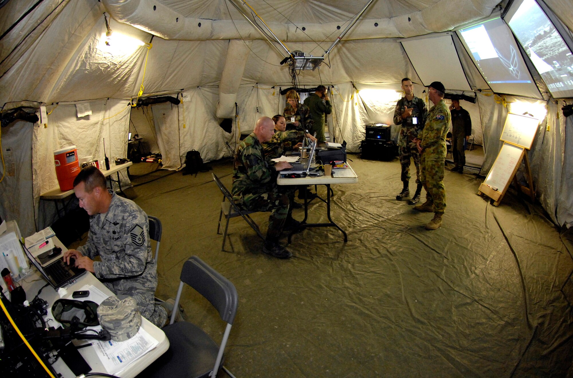 Members from the 36th Contingency Response Group man the tactical operation center during Exercise Pacific Lifeline Feb. 5 at Kona International Airport, Hawaii. Pacific Lifeline is a total force exercise staging from three locations within the Hawaiian Islands. It provides approximately 900 Department of Defense members a test environment to rapidly deploy and provide time-critical services in the wake of a simulated natural disaster. (U.S. Air Force photo/Tech. Sgt. Shane A. Cuomo) 
