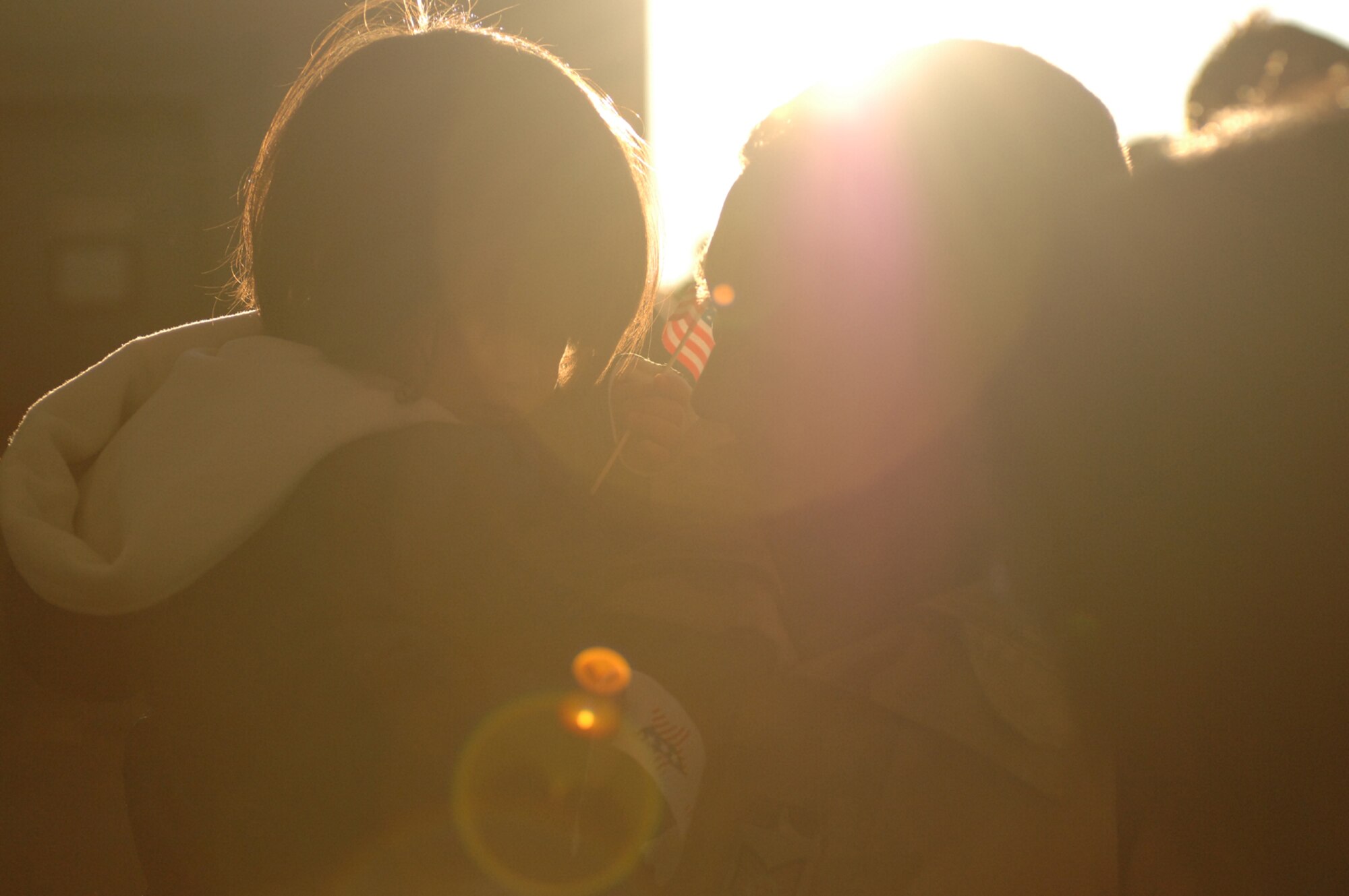 SPANGDAHLEM AIR BASE, Germany -- Staff Sgt. David Schwanke, 52nd Equipment Maintenance Squadron, holds his son Lucas upon his return from a deployment in support of Operation Iraqi Freedom, Feb. 8, 2008. (U.S. Air Force photo/Senior Airman Kristin Ruleau) 