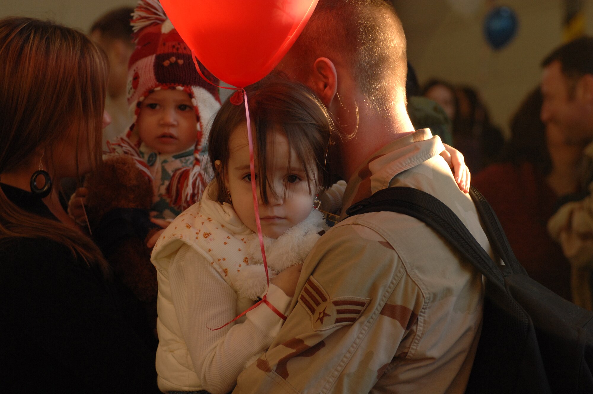 SPANGDAHLEM AIR BASE, Germany -- Senior Airman Jason McBride, 52nd Equipment Maintenance Squadron, holds his daughter Kristen upon his return from a deployment in support of Operation Iraqi Freedom, Feb. 8, 2008. (U.S. Air Force photo/Senior Airman Kristin Ruleau) 