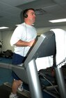 YOUNGSTOWN AIR RESERVE STATION, Ohio -- Air Force Reserve Tech. Sgt. Jerry Killian, a 910th aerospace maintenance technician and an ART, runs on a treadmill at the base Fitness Center each day after work here. He said although he doesn't really enjoy running, regular treadmill interval workouts and distance runs along with changes in diet helped him lose 33 pounds and whittle four inches off his waist since last summer. U.S. Air Force photo by Tech. Sgt. Bob Barko Jr. 