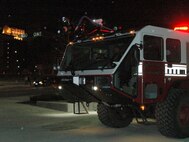 YOUNGSTOWN, Ohio -- The Air Force Reserve's 910th Civil Engineer Fire Department shows off a brand new fire truck just outside of the Chevrolet Centre with the downtown skyline in the background, Jan. 19. The fire truck was on display as part of the Youngstown SteelHounds professional hockey team's annual Military Night activities. U.S. Air Force photo by Tech. Sgt. Bob Barko Jr. 