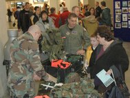 YOUNGSTOWN, Ohio -- Hockey fans check out a military display provided by the Air Force Reserve's 910th Security Forces Squadron at the Chevrolet Centre downtown, Jan. 19. The display was provided as part of Military Night during the Youngstown Steelhounds hockey game versus the Bossier-Shreveport Mudbugs. U.S. Air Force photo by Tech. Sgt. Bob Barko Jr.