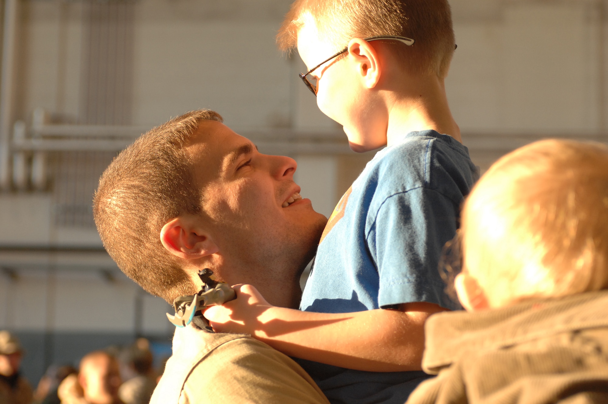 SPANGDAHLEM AIR BASE, Germany -- Staff Sgt. Sam Johnson, 52nd Aircraft Maintenance Squadron, holds his son Conner upon his return from a deployment in support of Operation Iraqi Freedom, Feb. 8, 2008. (U.S. Air Force photo/Senior Airman Kristin Ruleau) 