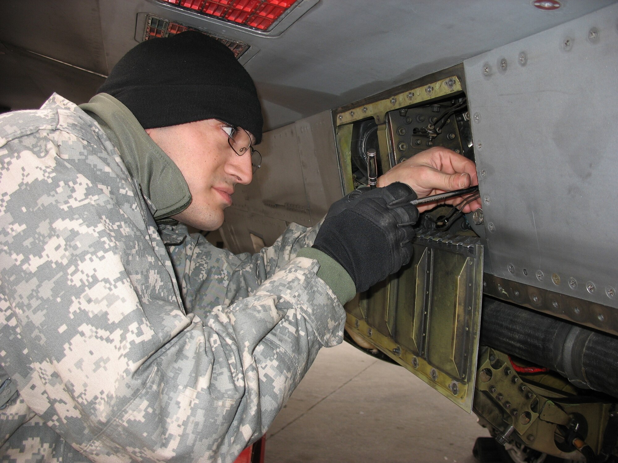 BALAD AIR BASE, Iraq – Staff Sgt. Michael Farrugia, 322nd Expeditionary Aircraft Maintenance Squadron engine technician, works on an F-16 engine. Sergeant Farrugia is deployed from Spangdahlem Air Base, Germany. (U.S. Air Force photo/Master Sgt. Dale Huizenga)