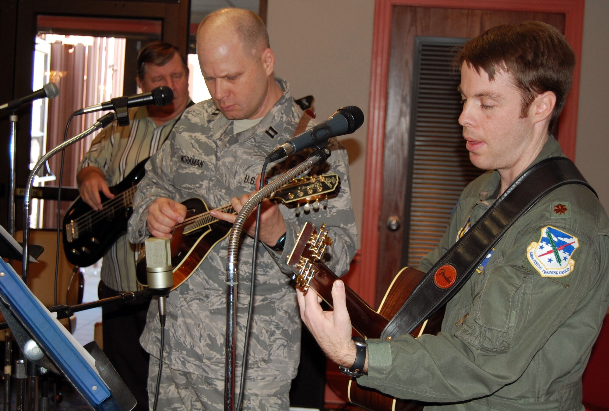 LAUGHLIN AIR FORCE BASE, Texas – Chaplain Capt. Shannon Workman, 47th Flying Training Wing Chaplain, and other base members play different types of music for the National Prayer Luncheon at Club XL Feb. 5. (U.S. Air Force photo by Airman 1st Class Sara Csurilla)