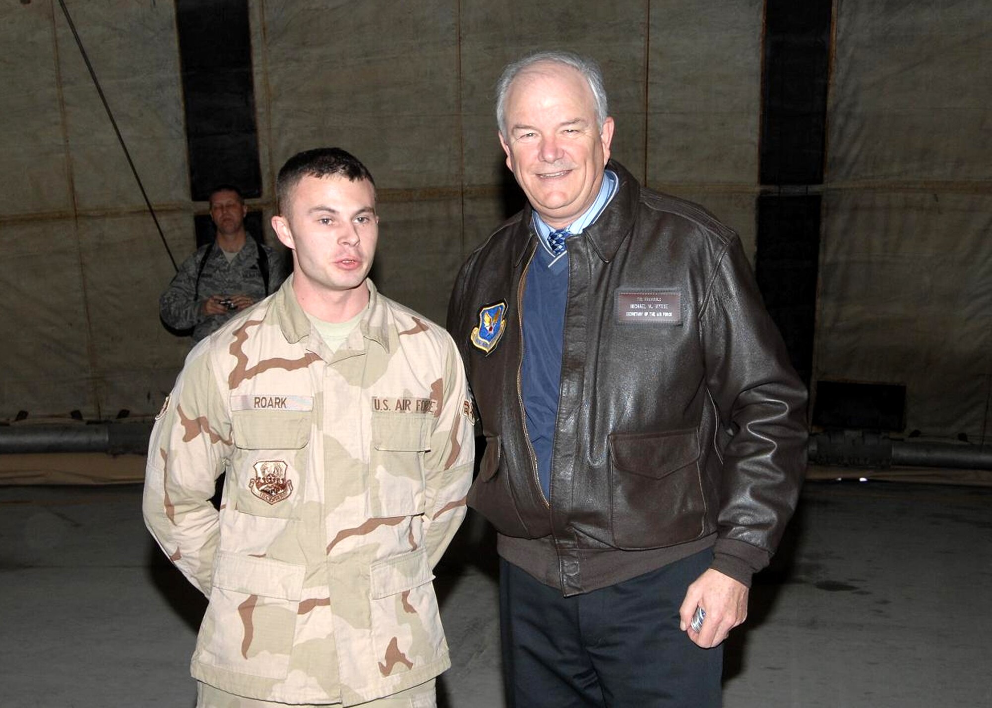 BAGRAM AIR BASE, Afghanistan – Secretary of the Air Force Michael W. Wynne recognizes Airman 1st Class William Roark, 455th Expeditionary Aircraft Maintenance Unit, with his coin for his outstanding performance while deployed Feb. 4, 2008. Sergeant King is deployed from Spangdahlem Air Base, Germany. (U.S. Air Force photo/Master Sgt. Demetrius Lester)