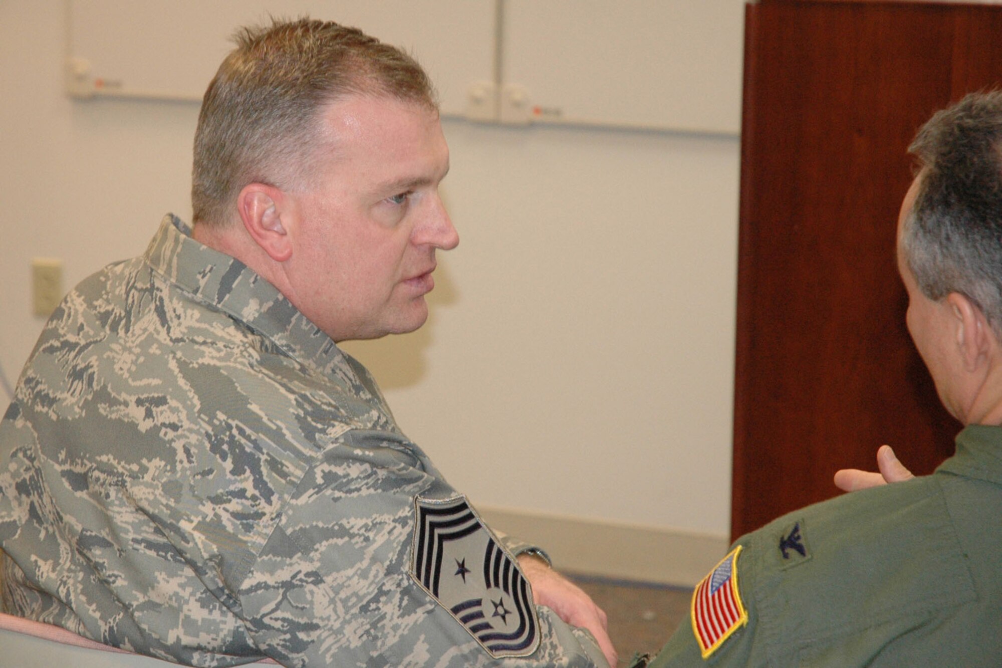 YOUNGSTOWN AIR RESERVE STATION, Ohio – The Air Force Reserve's 910th Airlift Wing's new Command Chief, Chief Master Sgt. Troy K. Rhoades, discusses an issue with Col. Karl McGregor, commander of the 910th Airlift Wing, during the February UTA here.  The command chief said he and Col. McGregor have an open and direct path between them. "I believe we're on the same page with the direction of the 910th: We have an outstanding wing with outstanding people wanting to do an outstanding job." U.S. Air Force photo/Senior Airman Ann Wilkins Jefferson. 