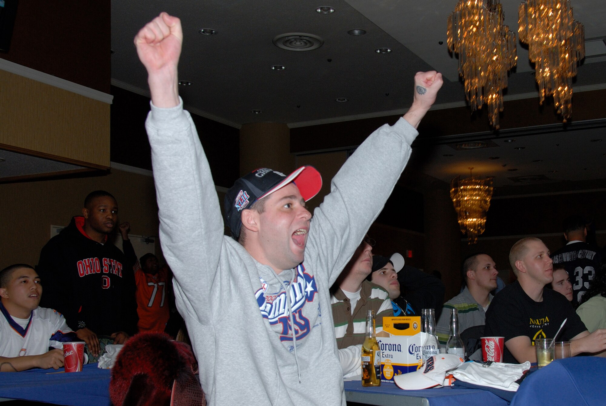 MISAWA AIR BASE, Japan -- Staff Sgt. Brian Cofrancesco, 35th Aircraft Maintenance Squadron, cheers as the New York Giants win the game against the New England Patriots during Superbowl XLII, Feb. 4, 2008.  The Giants won the game against the previously undefeated Patriots with a final score of 17-14.  (U.S. Air Force photo by Senior Airman Laura R. McFarlane)