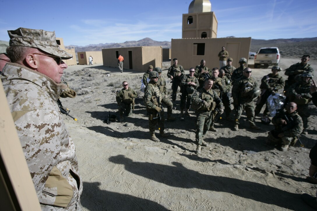 Brig. Gen. Melvin G. Spiese, commanding general of Marine Corps Air Ground Combat Center Twentynine Palms, Calif., observes a debrief conducted by Advisor Training Group instructors after a training scenario Feb. 9, 2008, in Hawthorne, Nev.  Embedded Trainer Teams based out of Okinawa, Japan, and Hawaii are training for an upcoming deployment to Afghanistan where they?ll be tasked with mentoring, training and advising the Afghan National Army to become a self-efficient military force.  The teams are in the final phase of the 21-day long pre-deployment evolution dubbed Mountain Viper. (U.S. Marine Corps photo by Cpl. Michael S. Cifuentes)