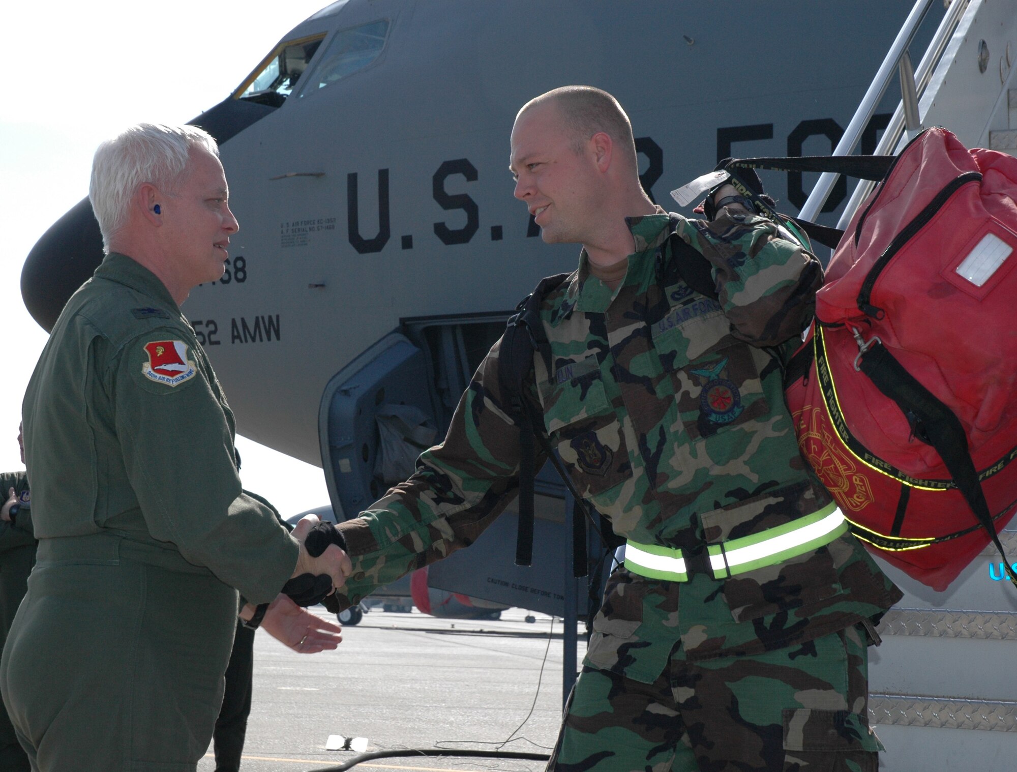 940th Air Refueling Wing vice commander, Col. David Mitchell, greets returning warrior, Master Sgt. Troy Velin, a fire fighter assigned to the 940th Civil Engineer Squadron, Feb. 9, 2008. Sergeant Velin, along with about 180 other Air Force Reservists from Beale Air Force Base, Calif., spent five days in Gulfport, Miss. They were practicing their war fighting skills for this operational readiness inspection, which exposes them to a hostile environment. Many of the wing's Reservists have already deployed in support of the Global War on Terror. (US Air Force photo/Master Sgt Ellen L Hatfield)  