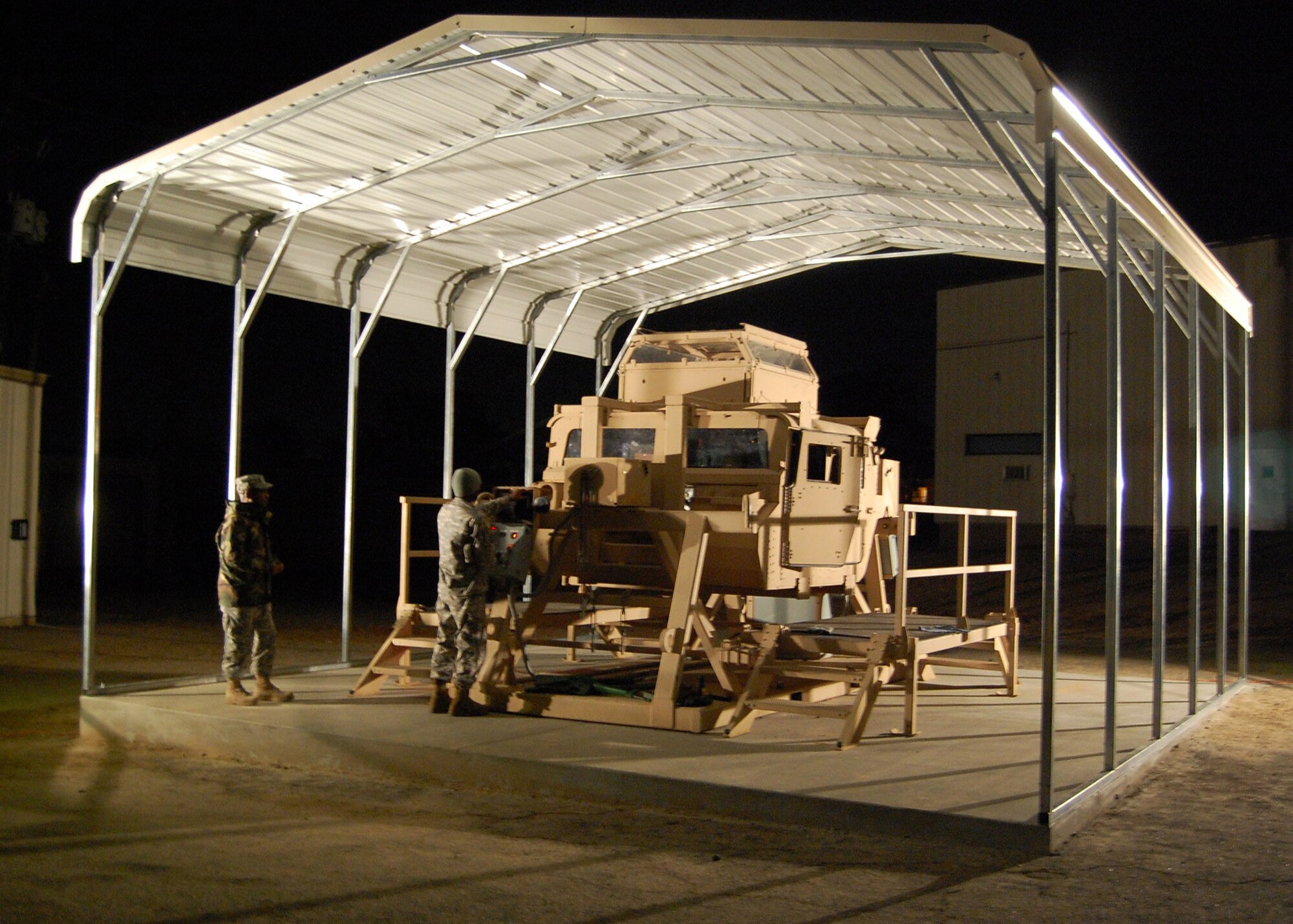 Army Staff Sgt. Carl Burrow and Sgt. Cassius Harris prepare Fort Bragg’s H.E.A.T. trainer for the next class of PRT members to complete the practical application portion of their training. A Scripps-Howard News Service analysis from 2005 stated 1 in 4 casualties in the theater of operations were related to humvee accidents and rollovers during IEDs and other attacks and incidents. The H.E.A.T. prepares service members on how to react in the event their humvee rolls over.  (U.S. Air Force photo/Capt. Ken Hall)