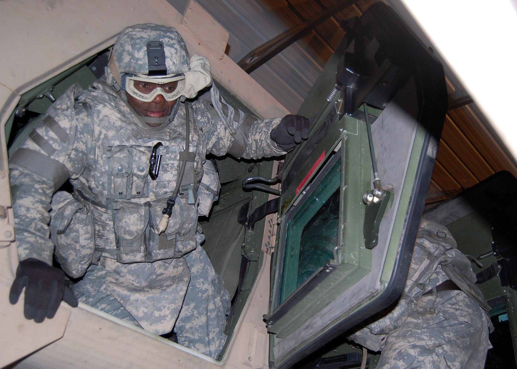 Provincial Reconstruction Team Gardez member Army Reserve Capt. Harold Cornish egresses an overturned H.E.A.T. humvee at Fort Bragg, N.C. A Scripps-Howard News Service analysis from 2005 stated 1 in 4 casualties in the theater of operations were related to humvee accidents and rollovers during IEDs and other attacks and incidents. The H.E.A.T. prepares service members on how to react in the event their humvee rolls over.   (U.S. Air Force photo/Capt. Ken Hall)