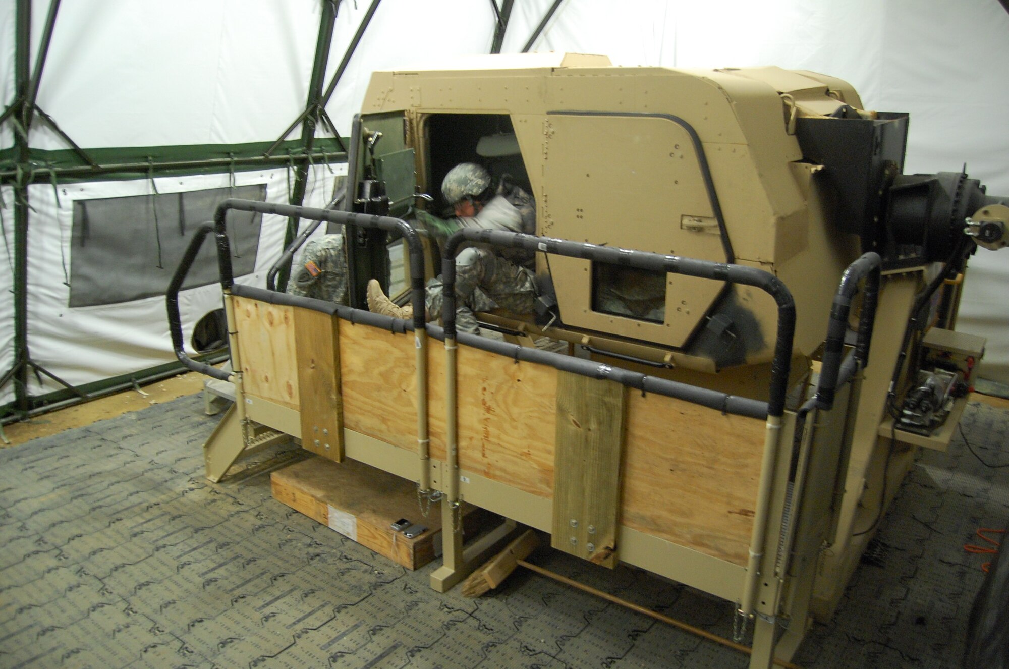 Provincial Reconstruction Team Gardez member Army Reserve 1st Lt. Keith Spaniel egresses from what is now an upside-down humvee during H.E.A.T. training at Fort Bragg, N.C. A Scripps-Howard News Service analysis from 2005 stated 1 in 4 casualties in the theater of operations were related to humvee accidents and rollovers during IEDs and other attacks and incidents. The H.E.A.T., or “HMMWV Egress Assistance Training,” prepares service members on how to react in the event their humvee rolls over. (U.S. Air Force photo/Capt. Ken Hall)