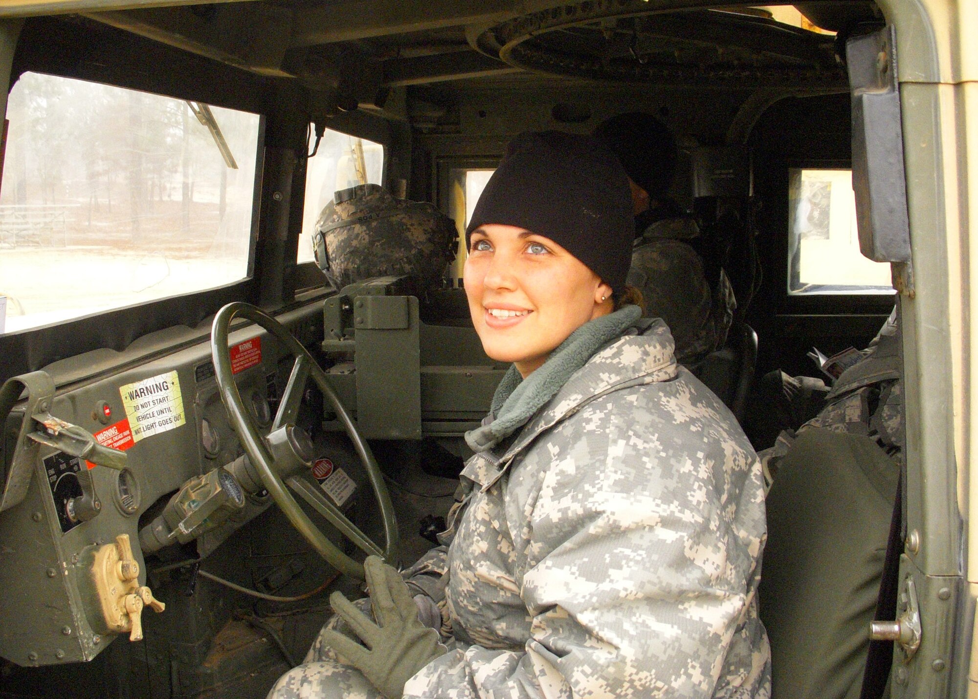 Staff Sgt. Leilani Garcia takes a moment before preparing for a mounted combat patrol at Forward Operating Base Patriot on Fort Bragg, N.C. Sergeant Garcia, deployed from Charleston Air Force Base, S.C., will forward deploy as a member of Provincial Reconstruction Team Gardez near the Pakistan border in Paktya Province, Afghanistan. (U.S. Air Force photo/Staff Sgt. Marla Franklin)