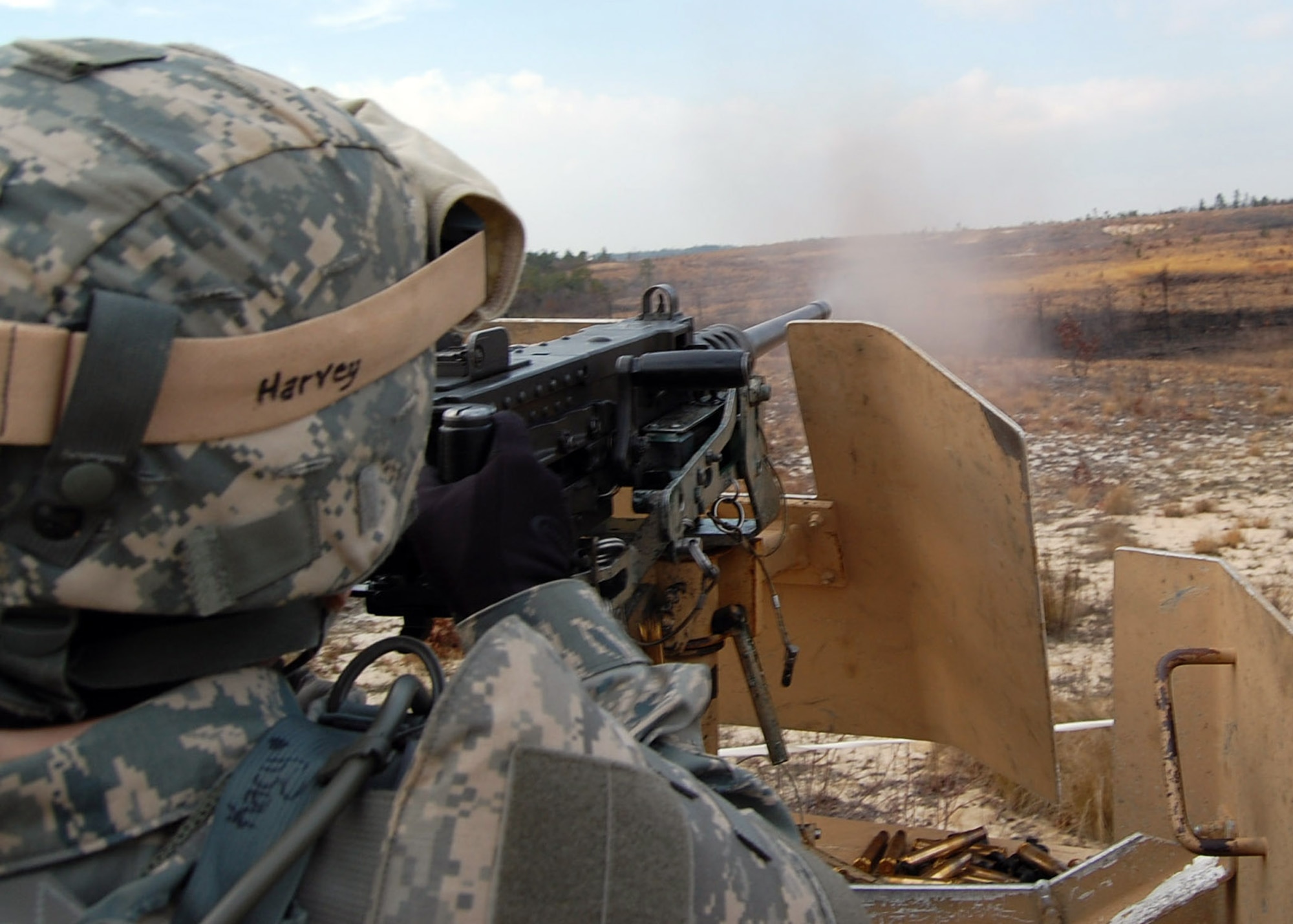 Staff Sgt. Kacy Harvey sends a 7-9 round burst of .50 caliber destruction downrange at Fort Bragg, N.C. The crew-served weapon is difficult to manage, but has devastating effect on the enemy, whether troops or equipment. Services Airman Sergeant Harvey deployed from Nellis Air Force Base, Nev., to serve on Provincial Reconstruction Team Gardez which forward deploys later this month to Paktya Province, Afghanistan, near the Pakistan border. (U.S. Air Force photo/Capt. Ken Hall)