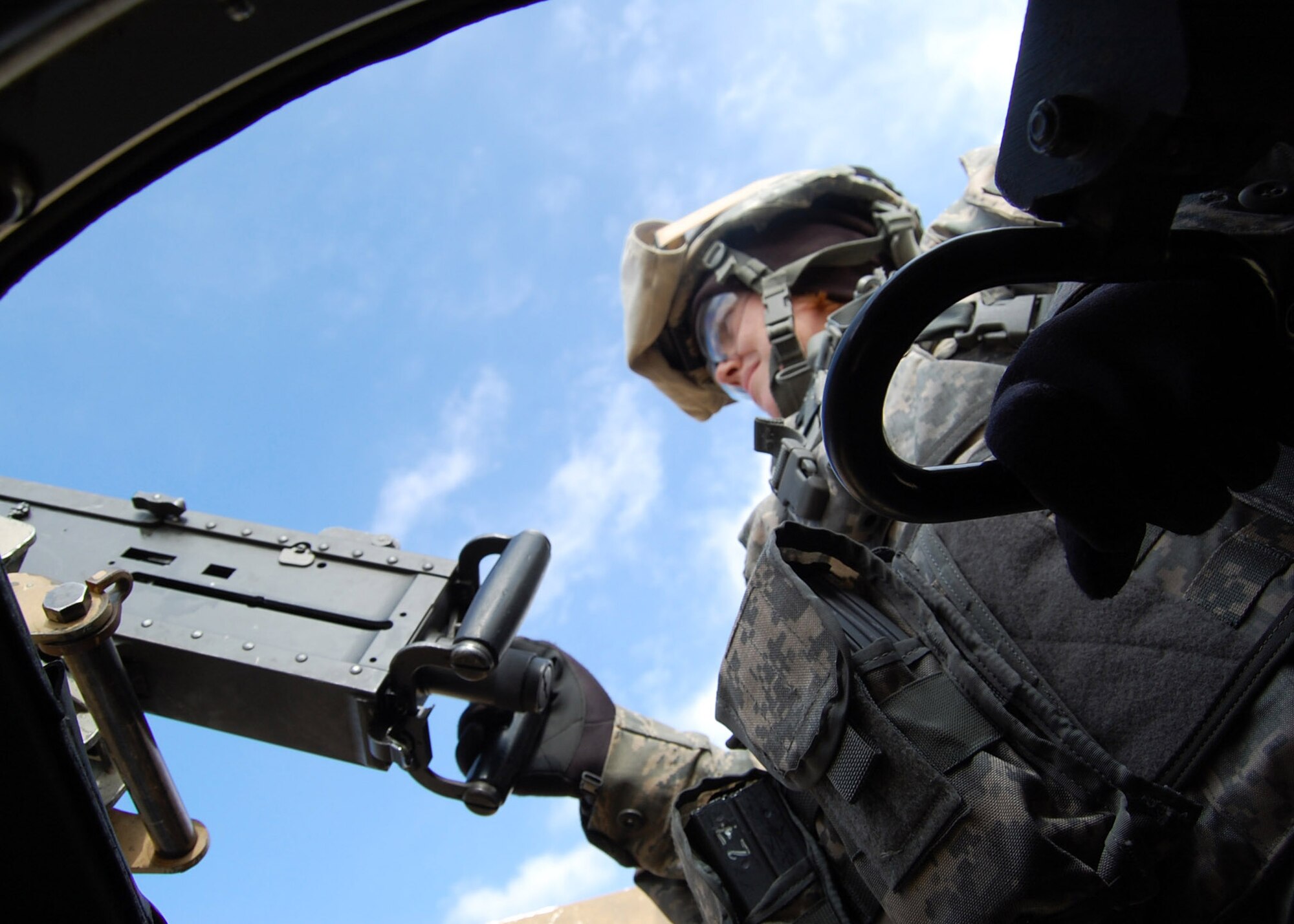 Staff Sgt. Kacy Harvey, who deployed from Nellis Air Force Base, Nev., swings the humvee gunner’s turret around to stay oriented in the direction of enemy activity on the .50 caliber gunnery range at Fort Bragg, N.C. The 5-foot, 3-inch Airman had no trouble at all manipulating the weapon to fire on downrange targets, hitting them all with devastating accuracy and effect. (U.S. Air Force photo/Capt. Ken Hall)