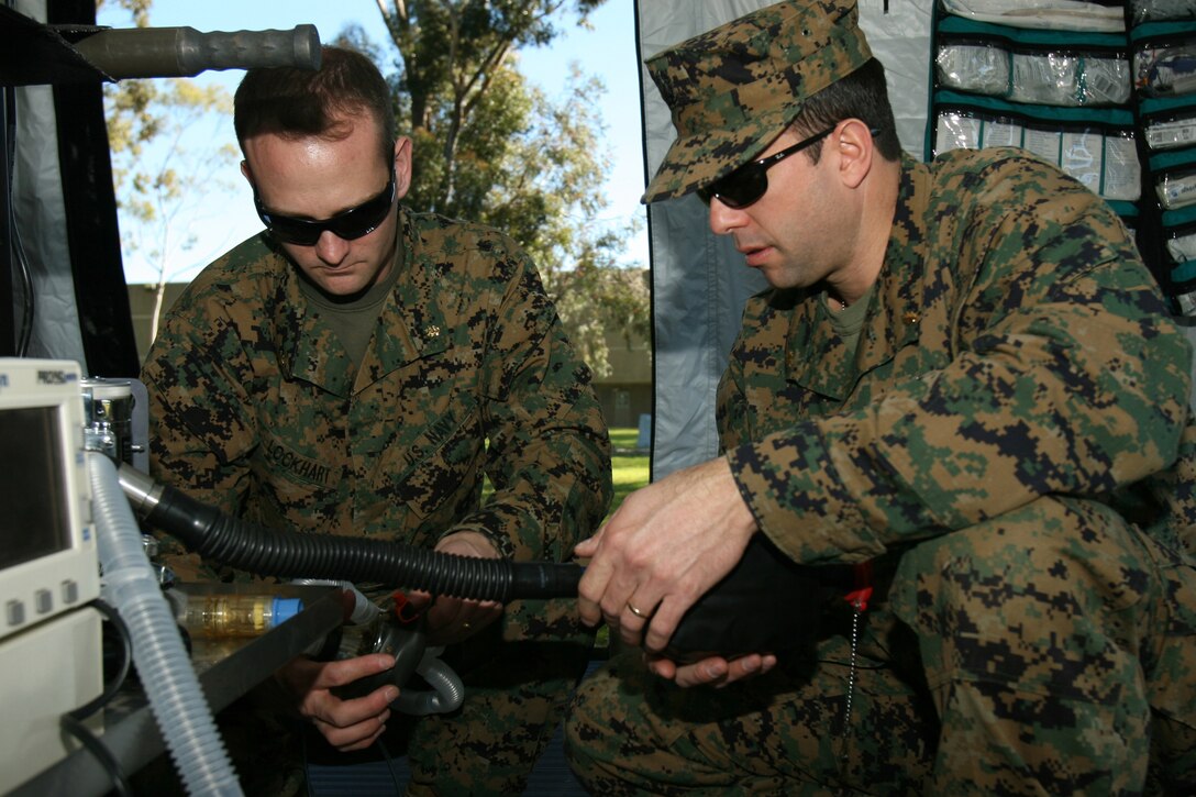 080209-M-2708O-0108.jpg ER.005 NAVY MARINE CORPS RESERVE CENTER SAN DIEGO - Navy Lt. Cmdr. Geoffrey R. Lockhart, and Navy Lt. Cmdr. Johnny J. Sacco, certified registered nurse anesthetists, with Company A, 4th Medical Battalion, 4th Marine Logistics Group, review the components of anesthesia equipment during annual training at the Navy Marine Corps Reserve Center San Diego, Feb. 9. The anesthetists have the responsibility of administering anesthetics and monitoring the life signs of patients. Lockhart is from Columbus, Miss while Sacco is a native of Mobile Ala. The corpsmen spent three days learning about portable medical equipment and non-medical equipment such as communications and humvees.  (U.S. Marine Corps photo by Lance Cpl. Christopher A. O'Quin) (Released)