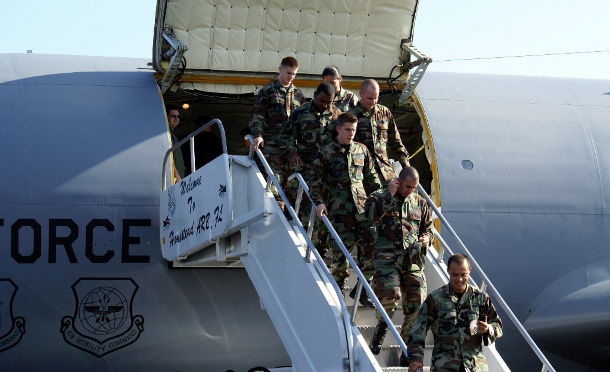 Thirty Reservists from Homestead Air Reserve Base step off of a KC-135 Stratotanker during an air refueling training mission with 93rd Fighter Squadron pilots on Feb. 9. The KC-135 crew was on a temporary duty assignment to Homestead ARB from Tinker Air Force Base, Okla., and offered to take the reservists along for a firsthand look at an air refueling training mission. (U.S. Air Force photo/Senior Airman Solomon Sklon)