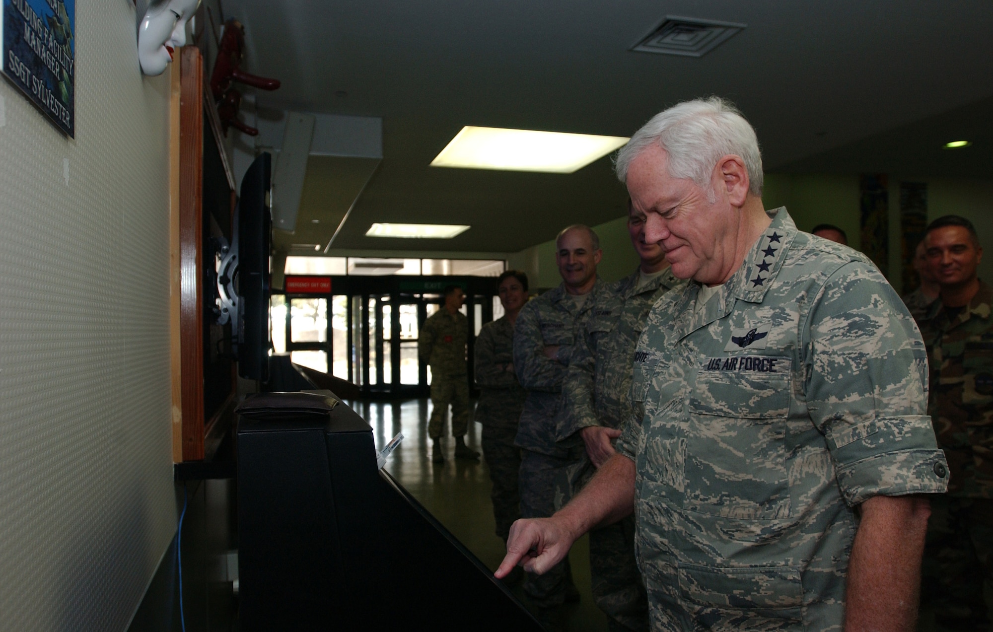 United States Air Force General Arthur J Lichte, the Air Mobility Commander uses one of the new kiosks that were recently installed in the passenger terminal located at Yokota Air Base Japan on 12 Feburary, 2008. General Lichte and his council are visiting the pacific regions mobility squardons to see how the air mobility commands men and women are supporting the mission. (United States Air Force photo by Senior Airman Brian Kimball)                                                              