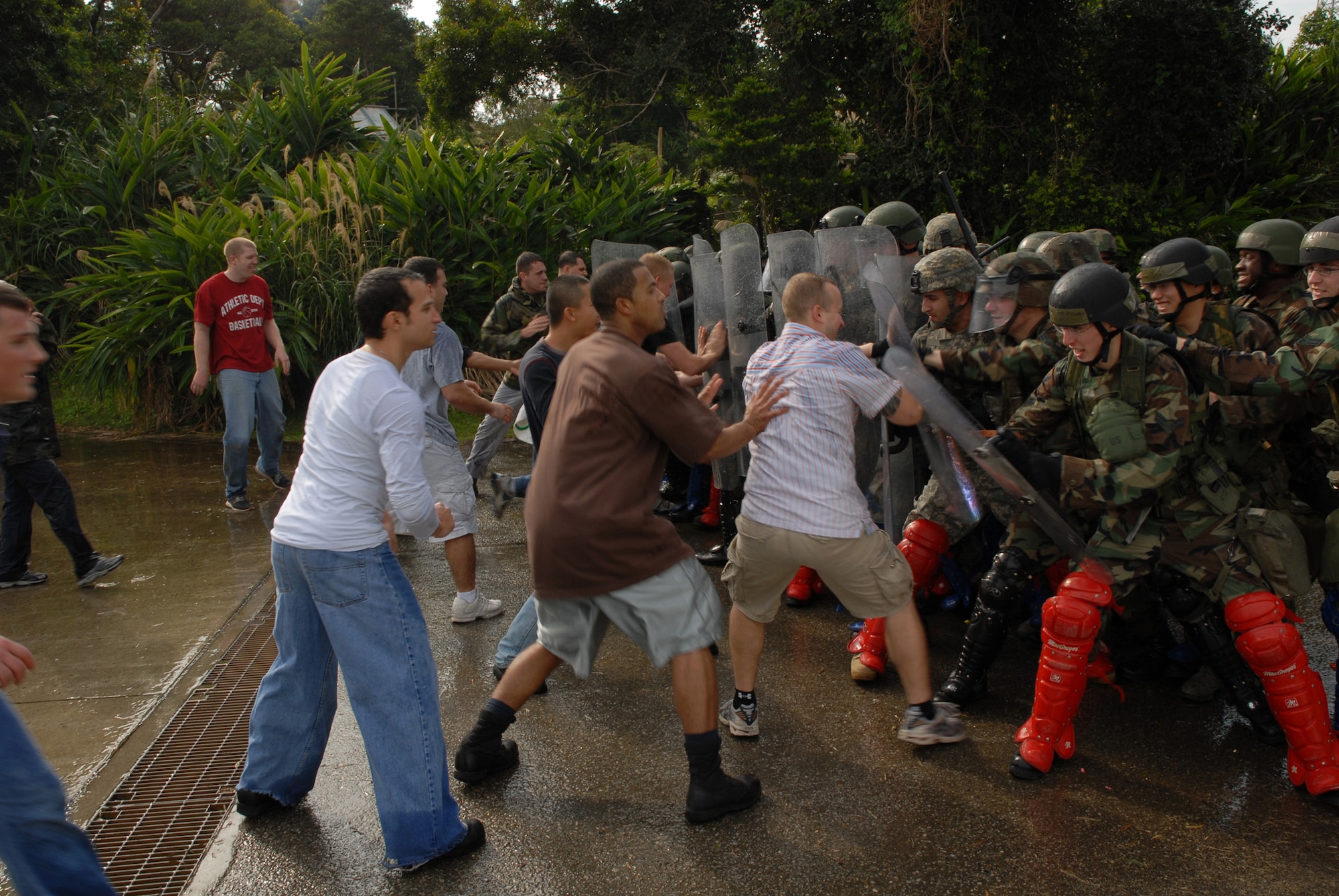 Protesters attempt break the line at a simulated protest during local operational readiness exercise Beverly High 08-4 at Kadena Air Base, Feb. 11, 2008. The 18th Wing conducted the exercise from Feb. 10 to 15 to test Airmen's ability to respond in contingency situations. (U.S. Air Force photo/Tech. Sgt. Jason Edwards) 