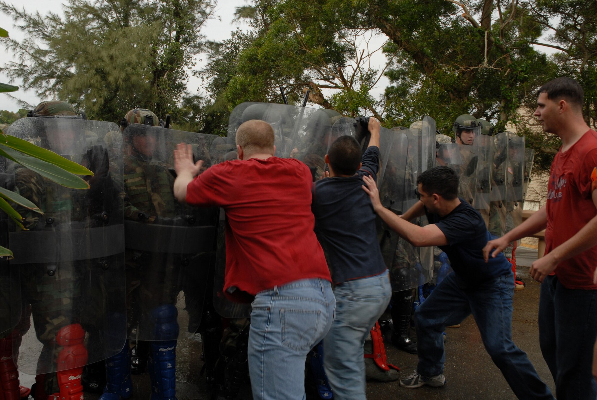 Protesters attempt to break the line at a simulated protest during local operational readiness exercise Beverly High 08-4 at Kadena Air Base, Feb. 11, 2008. The 18th Wing conducted the exercise Feb. 10 to 15, to test Airmen's ability to respond in contingency situations. (U.S. Air Force photo by/ Tech. Sgt. Jason Edwards) 