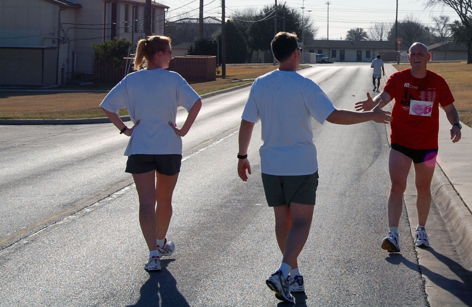 LAUGHLIN AIR FORCE BASE, Texas—(Far right) Lt. Col. John Turnipseed, overall race winner, receives a congratulatory handshake from Lt. Col. Cinnamon during the Valentine’s Day 5K Fun Run/Walk organized by the Losano Fitness Center Jan. 9, 2008. More than 100 base members and their families showed up to participate in the fun run/walk. Colonel Turnipseed, who finished the race ahead of all participants with a time of 22:58 minutes, is assigned to the 84th Flying Training Squadron. (U.S. Air Force photo by Senior Airman Olufemi Owolabi)