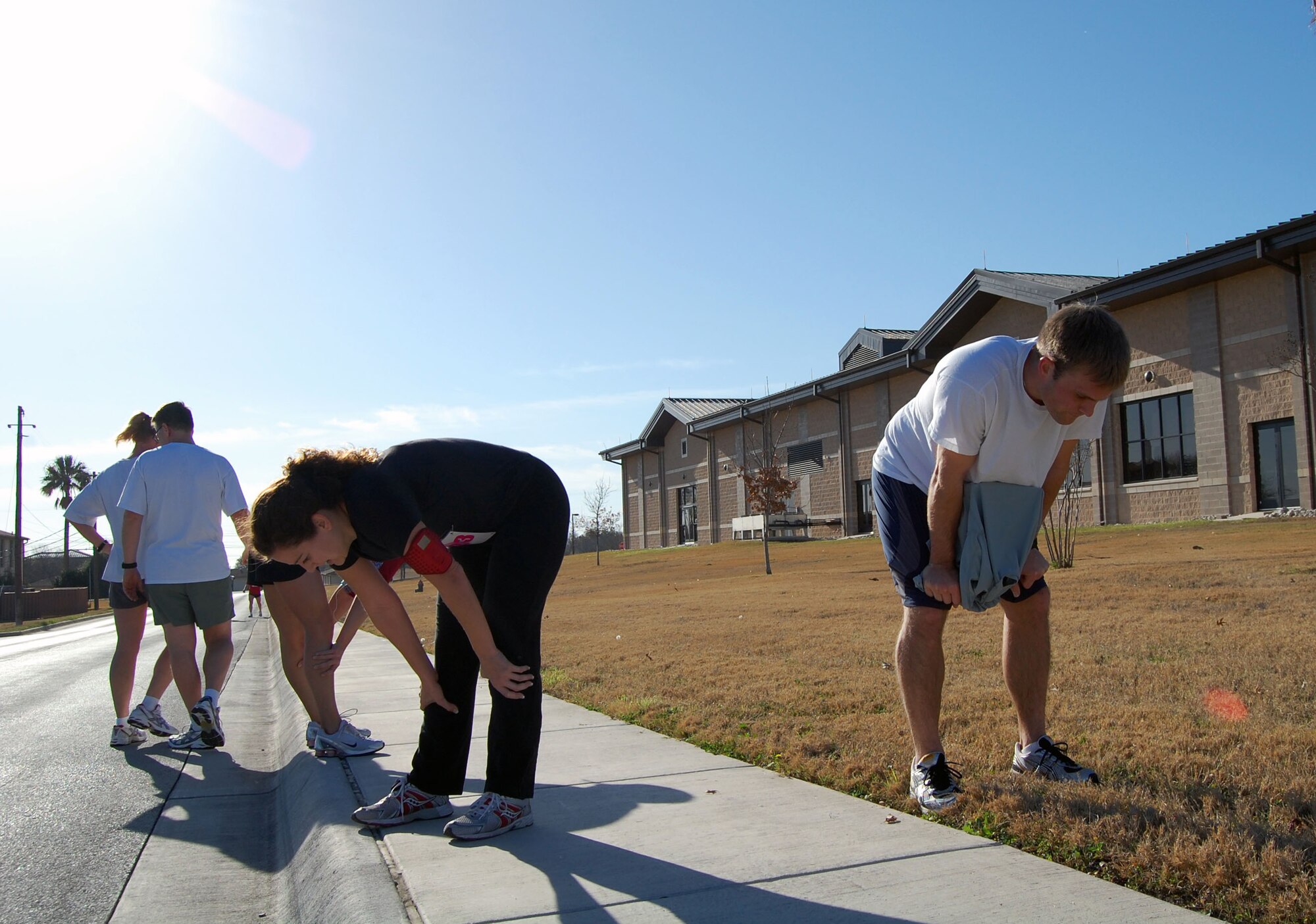 LAUGHLIN AIR FORCE BASE, Texas- Second Lt. Josh Wolfram, 47th Comptroller Squadron, and Capt. Tenaya Goc, 86th Flying Tsraining Squadron, take a deep breath immediately after completing the Valentine’s Day 5K Fun Run/Walk organized by the fitness center here Jan. 9, 2008. More than 100 members showed up to participate in Laughlin’s Valentine 5K Fun Run/Walk. The event is one of the many ways the Losano Fitness Center keeps Laughlin members fit to fight. (U.S. Air Force photo by Senior Airman Olufemi Owolabi)