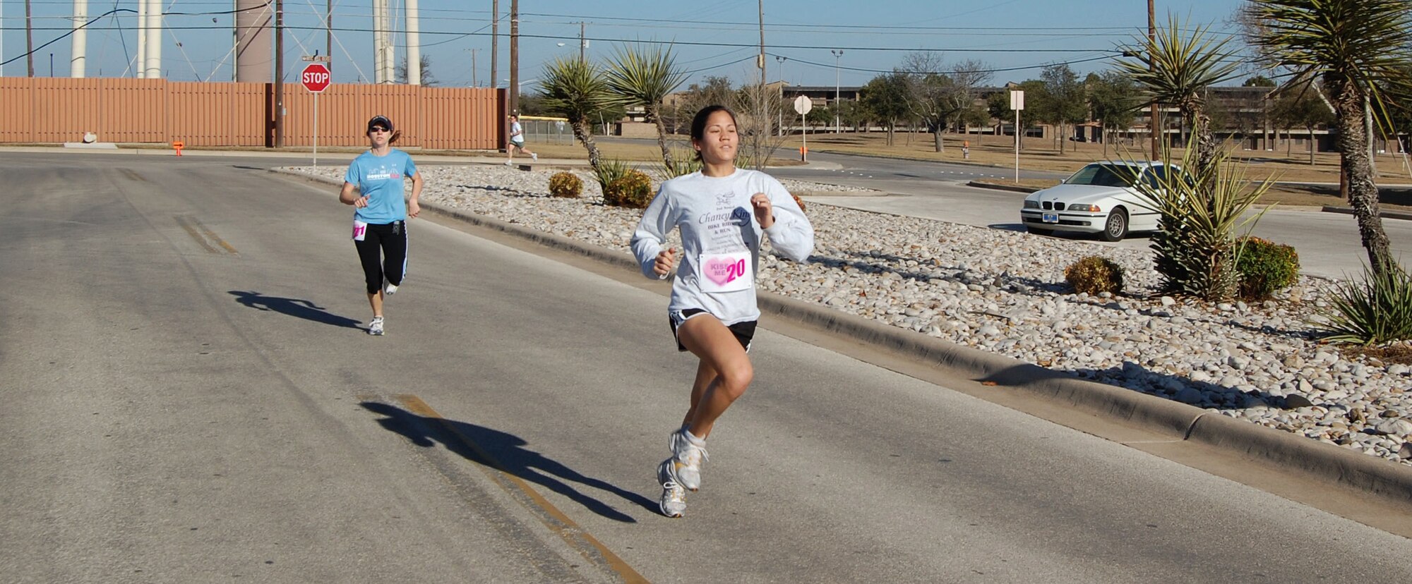 LAUGHLIN AIR FORCE BASE, Texas-- In the female category, ages 16 to 29, Stella Schiess and Katie Hale race to the finish line as the first and second-place winner, with a time of 23:50 and 23:52 minutes respectively, during the Valentine’s Day 5K Fun Run/Walk Jan. 9, 2007. More than 100 base members and their families participated in the event organized by the Losano Fitness Center. Stella and Katie are assigned to the 87th Flying Training Squadron and the 47th Operations Support Squadron respectively. (U.S. Air Force photo by Senior Airman Olufemi Owolabi)